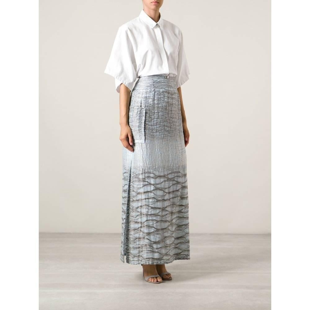 Jean Louis Scherrer 90s long A-line skirt. Threads details between two layers, patch pockets, two side slits. Silver tone decorative buckle closure and side concealed zip fastening.

Size: 38 IT

Flat measurements
Height: 107 cm
Waist: 34 cm
Hips: