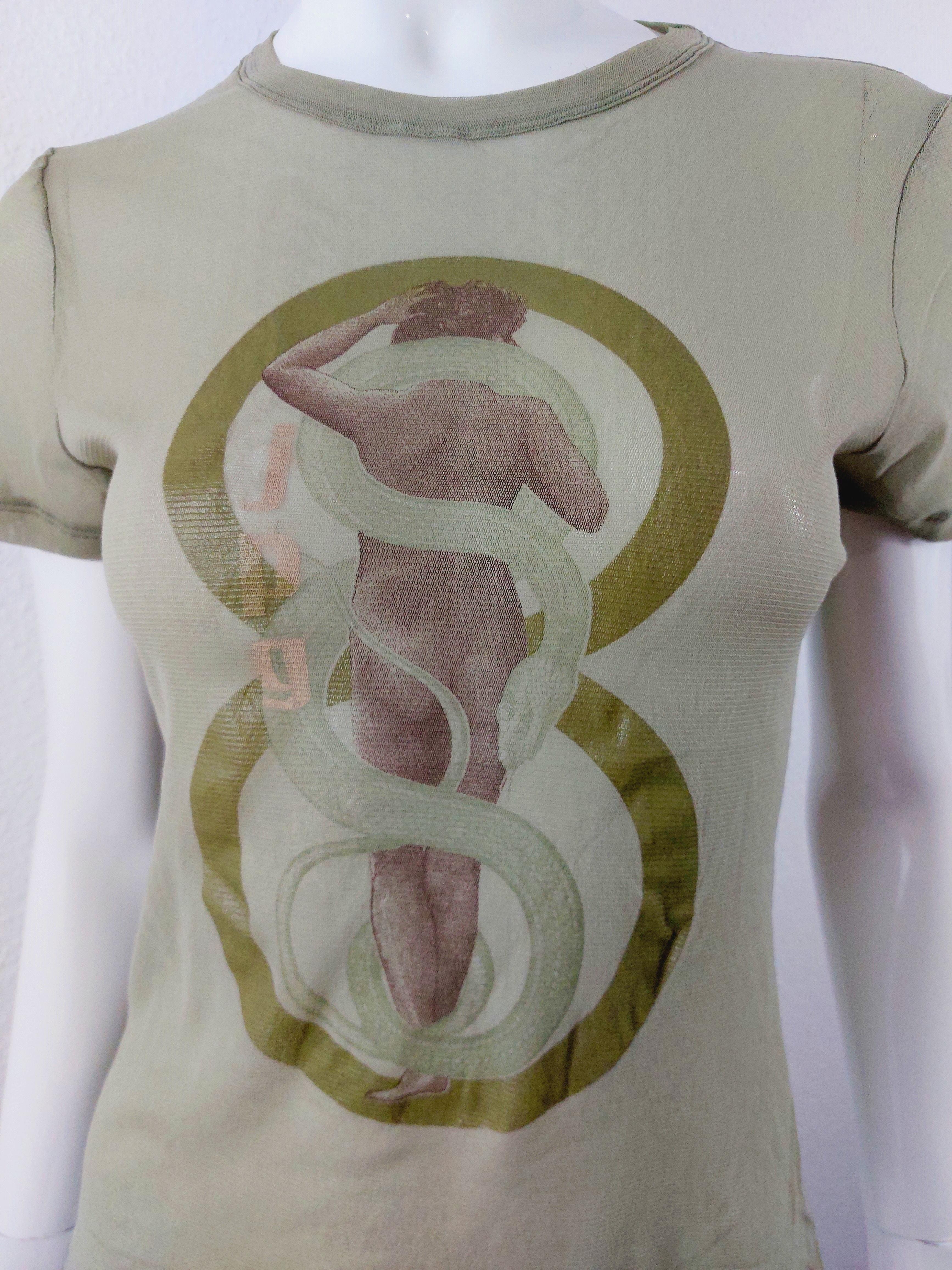 90s Jean Paul Gaultier Nude Woman Snake Sheer Mesh Club Kid Tattoo Top Shirt

Wonderful 1990s Jean Paul Gaultier tattoo top. This print is fantastic with a nude woman and an entwined snake.
 T shirt is cut straight and could be unisex. 
Label Jean