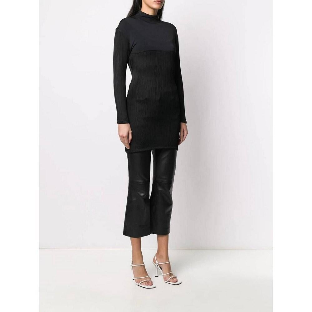 Jean Paul Gaultier black viscose blend top. Model with high collar, zip on the back and ribbed details.

Size: 42 IT 

Flat measurements 
Height: 84 cm
Shoulders: 44 cm 
Bust: 37 cm
Sleeves: 52 cm

Product code: A5911

Notes: The product shows some