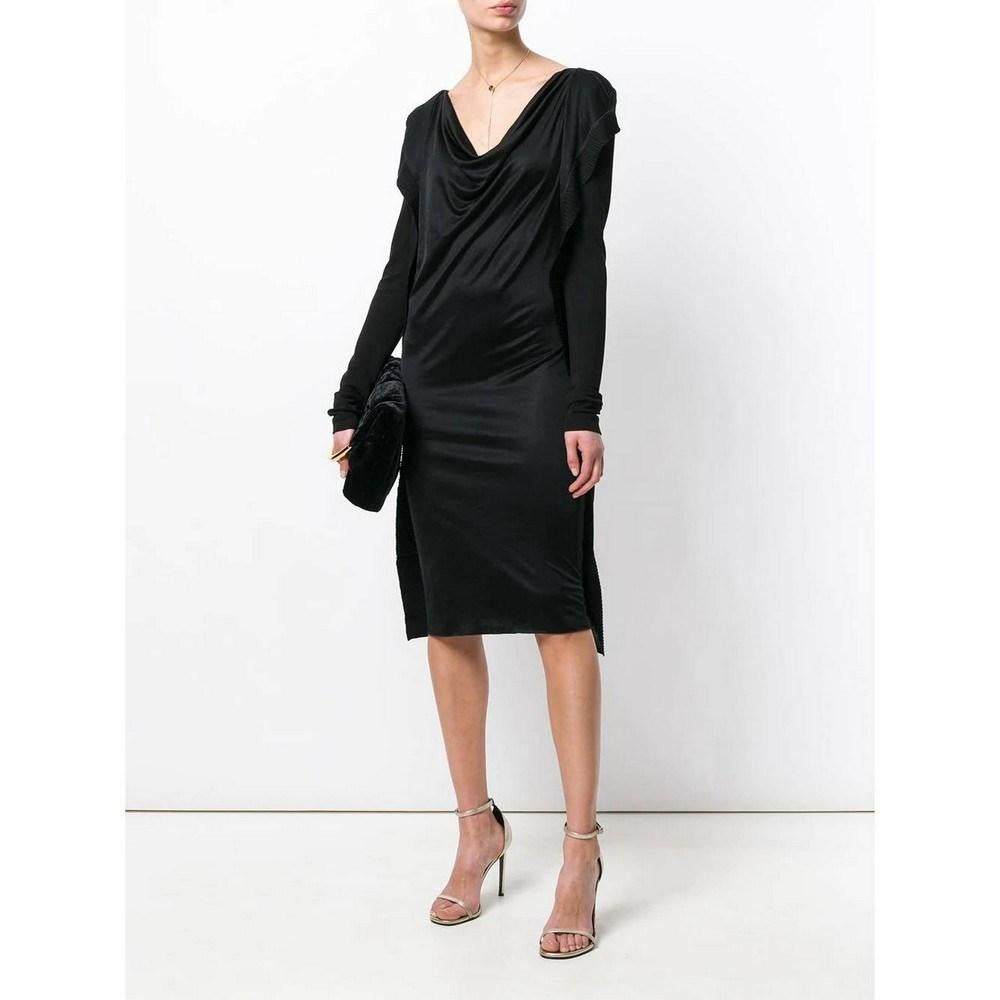 Jean Paul Gaultier black wool dress featuring a knitted back. Cowled neckline, long sleeves and front drape.

Size: 42 IT

Flat measurements
Height: 97 cm
Bust: 36 cm
Shoulders: 44 cm
Sleeves: 70 cm

Product code: A5782

Composition: Wool

Made in: