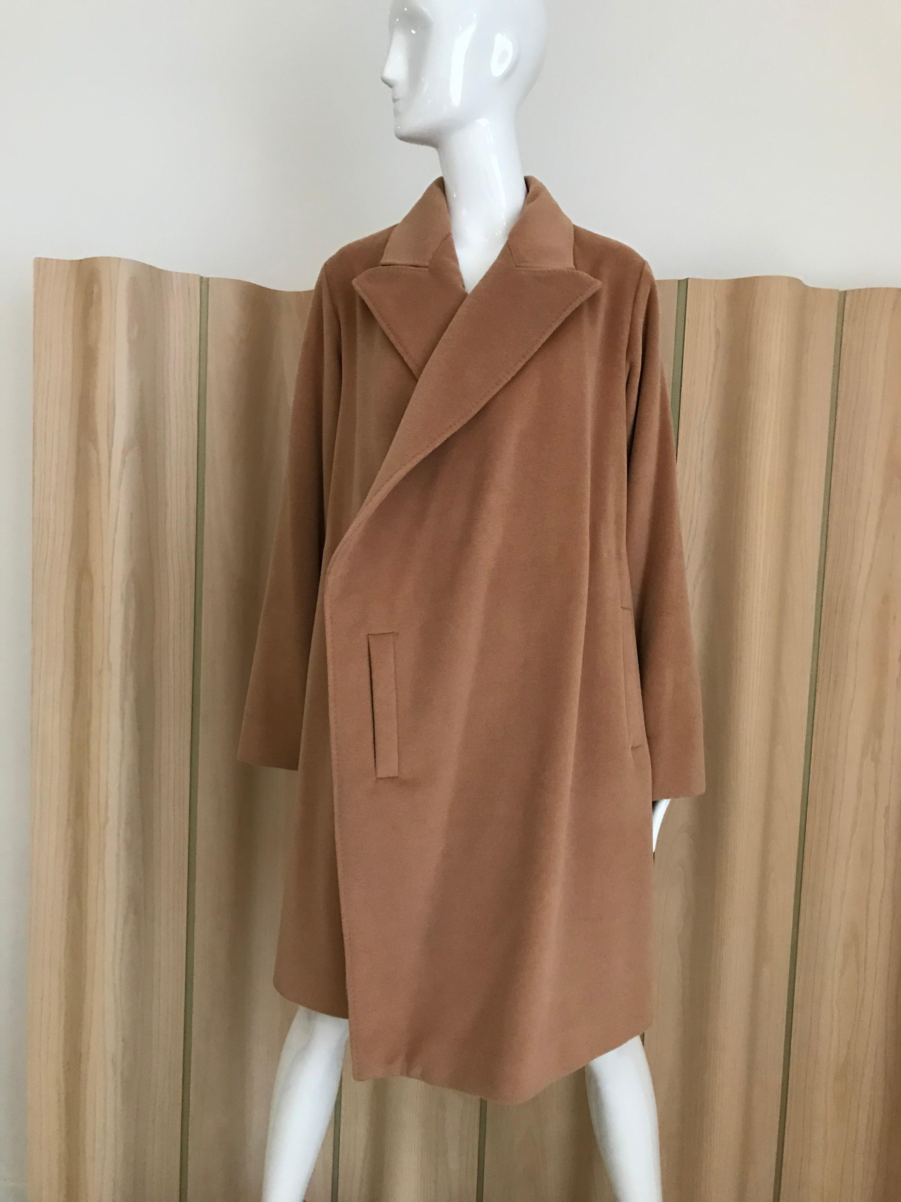 Chic and soft vintage 90s Jean Paul Gaultier wrap around cashmere coat in camel color lined in silk. coat comes with belt. 
Size : Medium / coat marked size 40 . Fit US size 6/8