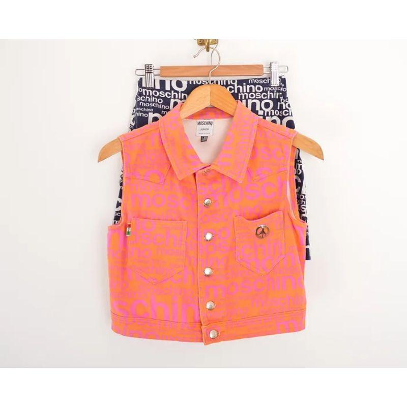 Epic Vintage 1990's Moschino 'Off Key' pattern sleeveless crop top - jacket, a Piece synonymous with UK Garage Rave style, in a sunset orange & pink colour way.

 Made in Italy !

Features:
Central line press stud fasten closure
'Moschino' embossed