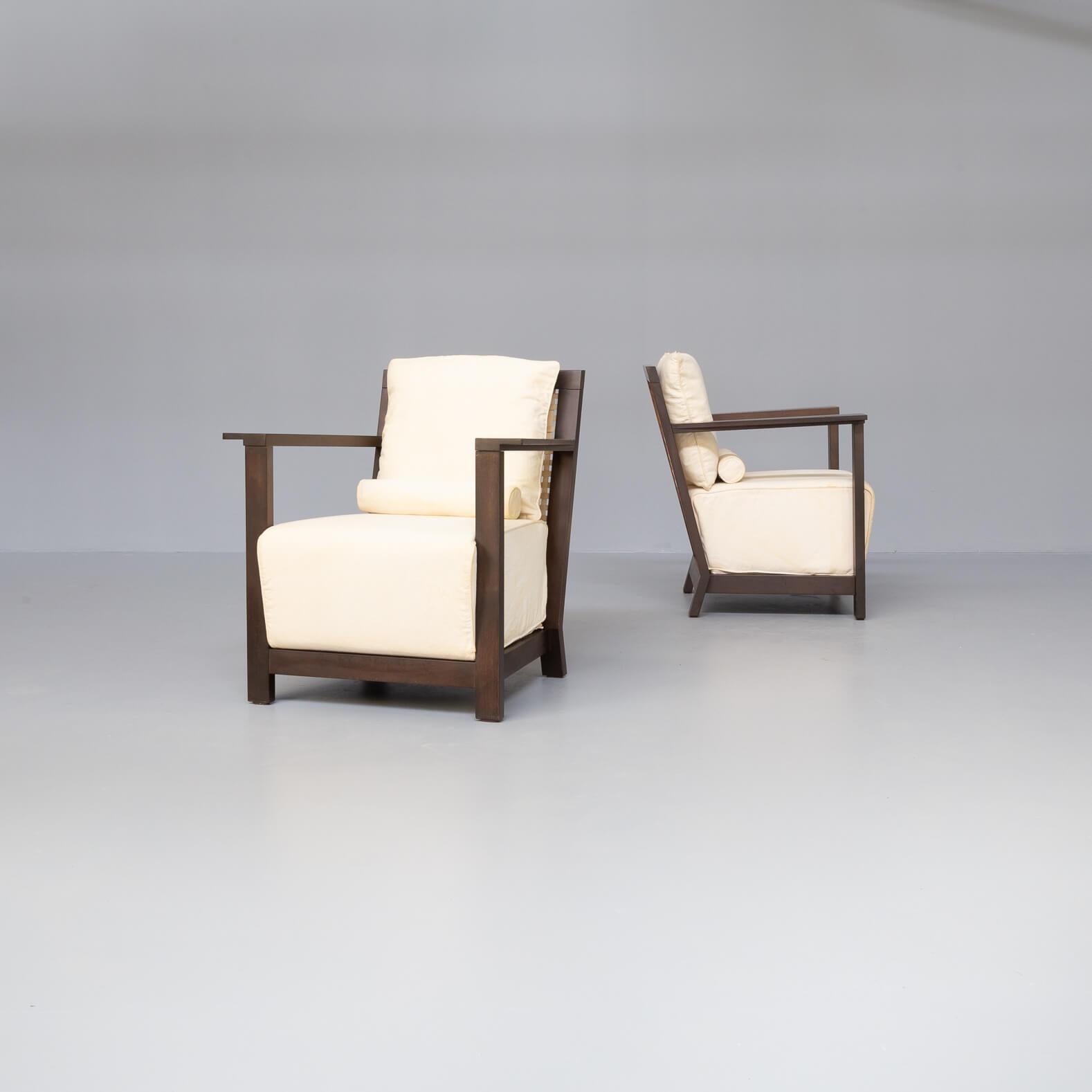 The Otto 111 lounge chairs have been designed bij Paola Navone in her duty as artistic director of the brand. Luxury feeling combined with normality. These set of two are in good condition consistent with age and use. The flexible fabric can be