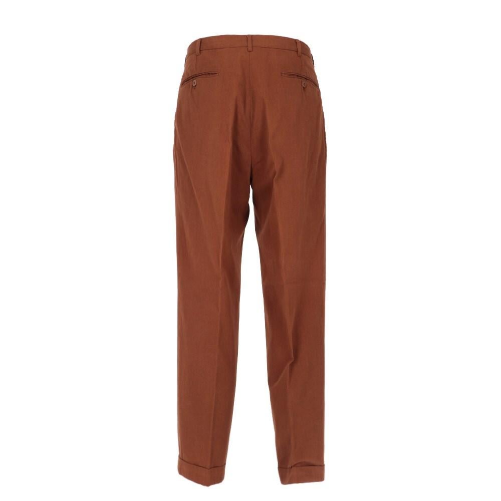 Romeo Gigli brown cotton trousers. Classic high-waist cut, front darts, two front welt pockets and two back pockets with button.

Size: 48 IT

Flat measurements:
Height: 101 cm
Waist: 39 cm
Inseam: 76 cm

Product code: X1050

Composition: 100%