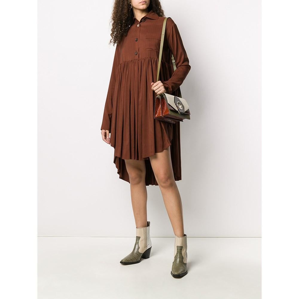 Romeo Gigli brown silk blend shirt dress with pleated asymmetric skirt, button front fastening and chest pocket.

Size: 44 IT

Flat measurements
Height: 110 cm
Waist: 54 cm
Sleeves: 47 cm
Shoulders: 63 cm

Product code: A7205

Composition: 70% Silk