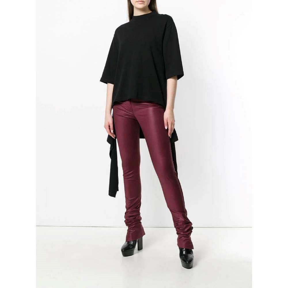 Romeo Gigli burgundy wool blend super skinny trousers. Low rise model, with button and zip fastening, extra long leg and side zipped knee-high openings.

Flat measurements size: 44 IT

Height: 133 cm
Inseam: 112 cm
Waist: 46 cm
Hips: 50 cm

Product