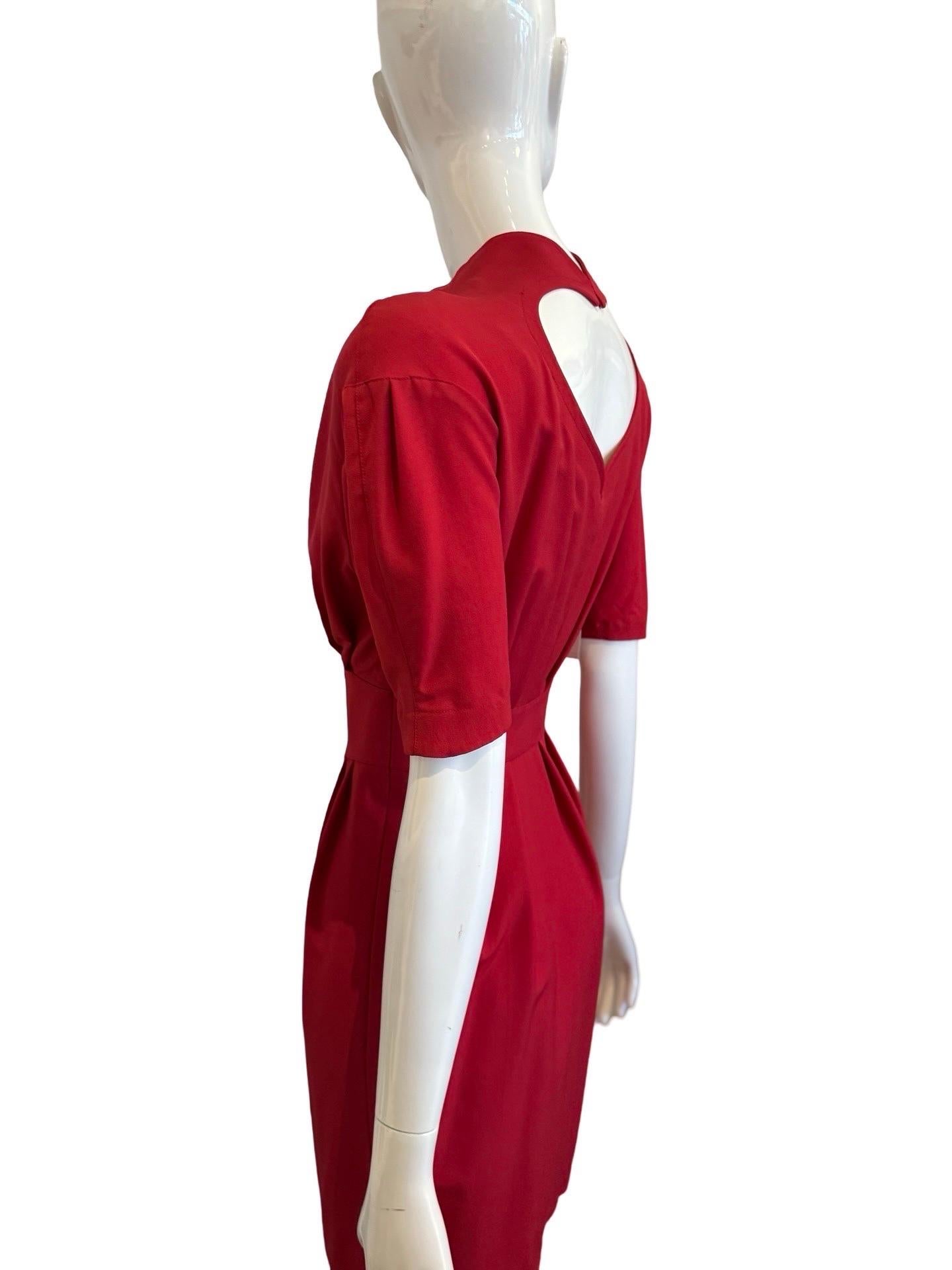 Manfred Thierry Mugler was a French fashion designer who began his brand in the 1970s and was known for his avant-garde, architectural, hyperfeminine and theatrical approach.

This is a wonderfully sweet dress from 90's Thierry Mugler.  Red crepe