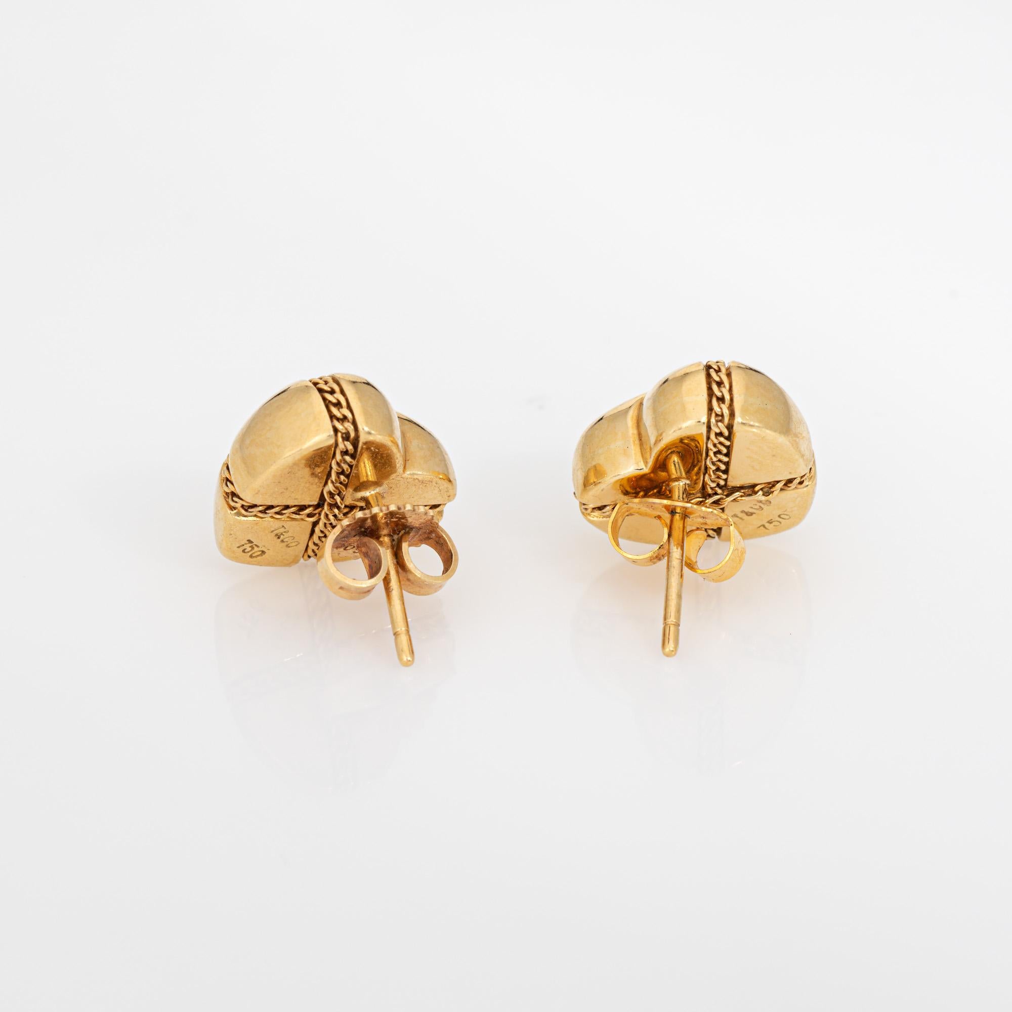 Finely detailed pair of vintage Tiffany & Co heart chain cross earrings crafted in 18k yellow gold.  

Dating to the 1990s the 'Cross My Heart' stud earrings are crafted in 18k yellow gold. The earrings are fitted with post and butterfly backings