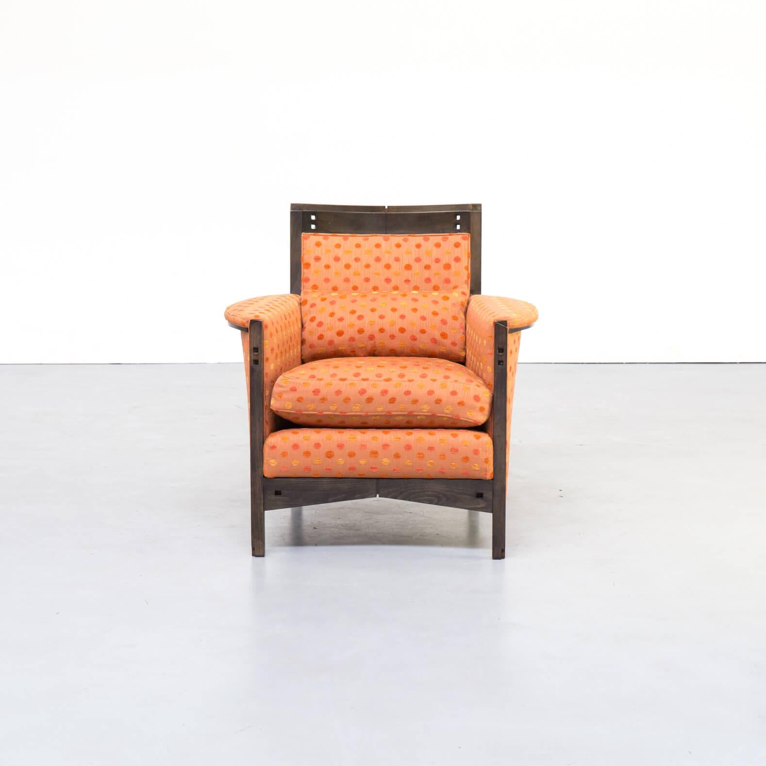Beautiful and very comfortable lounge chair designed by Umberto Asnago for Giorgetti in the 1990s. Orange fabric, darkened beech wooden frame. Good condition consistent with age and use.