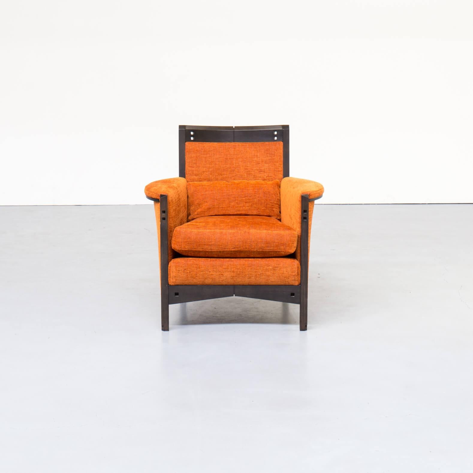 Beautiful designed lounge fauteuil by Umberto Asnago for Giorgetti. Very detailed wood, and nice orange fabric in good condition consistent with age and use.