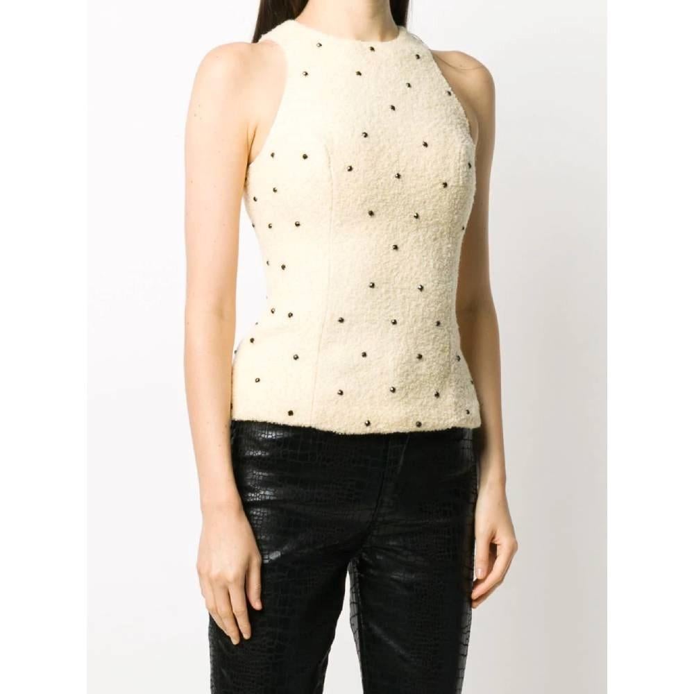 Versace beige wool sleeveless top with black stones and round collar. Zip closure on the back.

Size: 38 IT

Flat measurements
Height: 57 cm
Bust: 37 cm
Weist: 31 cm

Product code: A7071

Composition: Outer: 60% Wool – 20% Polyamide – 20%