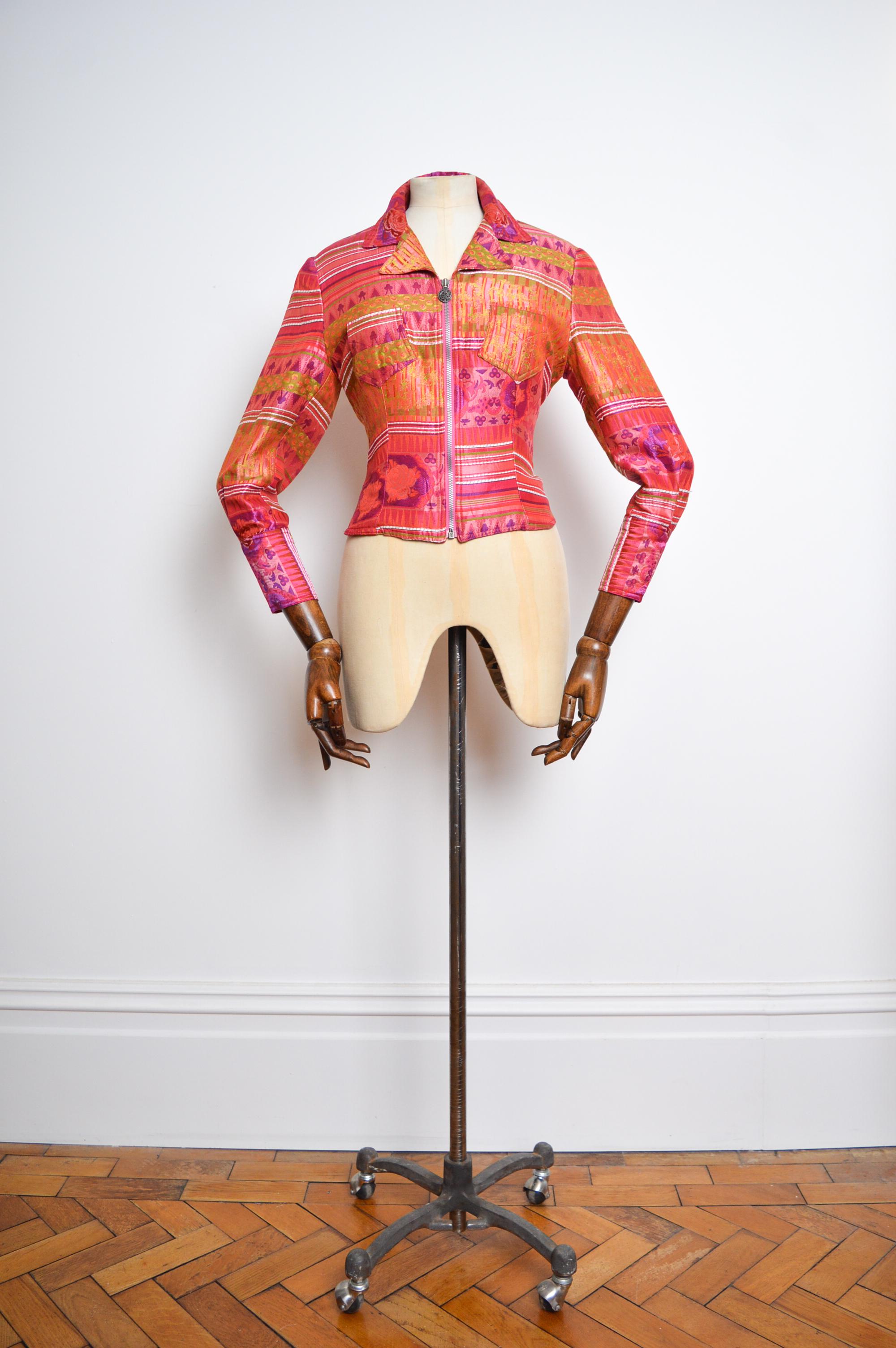 Fabulous 1990's Vintage Zip down Jacquard Jacket by Christian Lacroix, in beautiful hot pink and orange 'LaCroix' signature material, with a fitted cut that gives the garment and a sculpted silhouette.   

MADE IN FRANCE.  

Pit to pit - 18.5