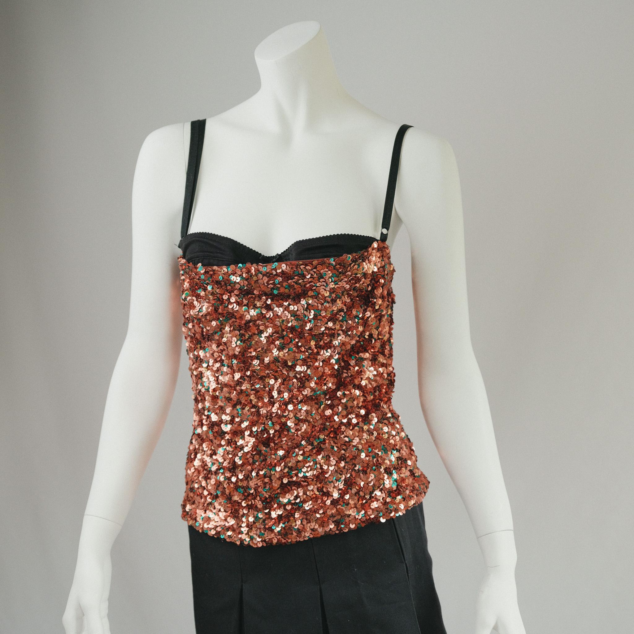 90s Vintage Dolce and Gabbana Bronze  sequin corset top featuring exposed bra detail, black adjustable straps, and center back zipper closure. 

exquisite, would keep if this fit me 


Size: 40 UK10 
Pictured on size 6 UK pinned 

Very Good Vintage