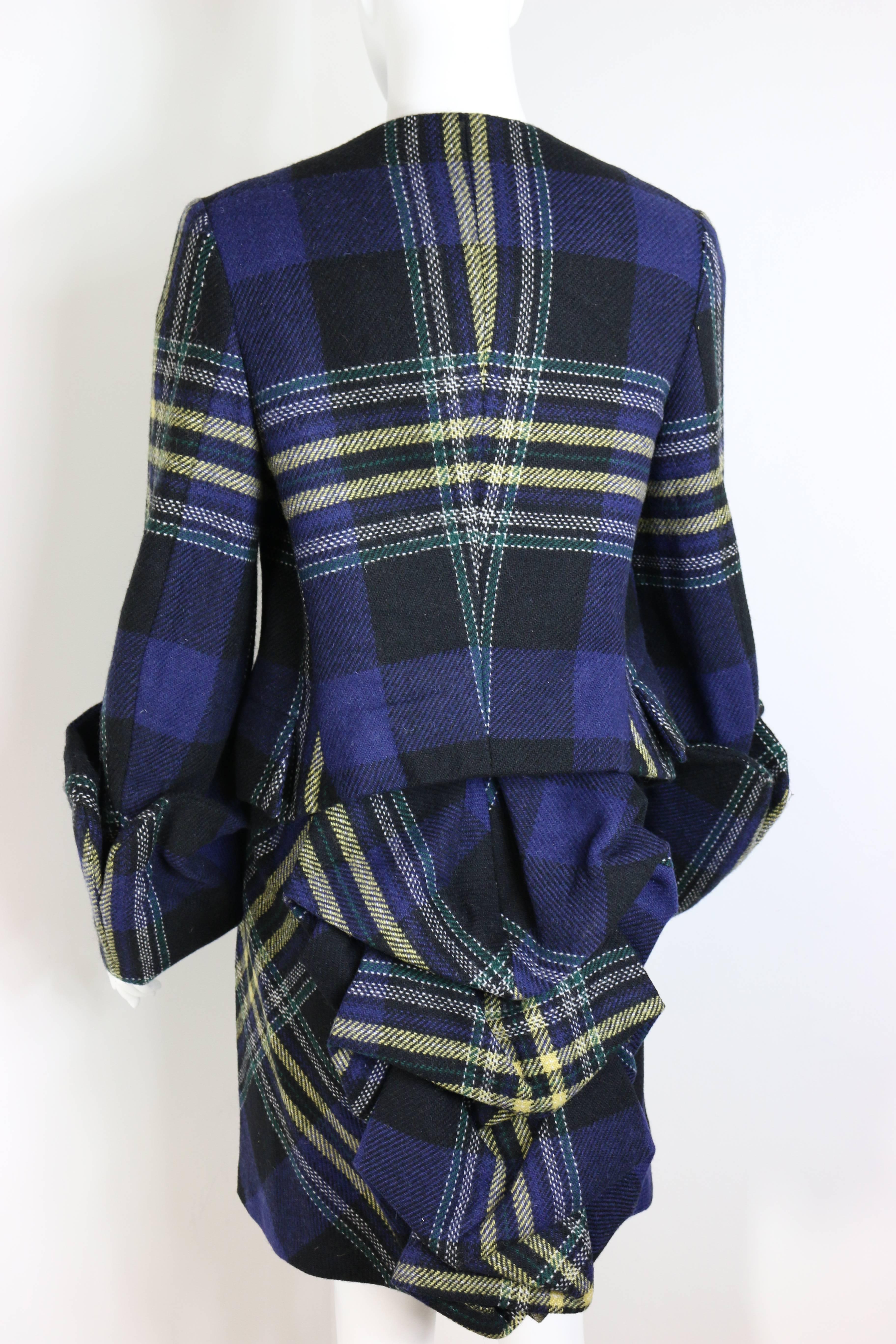 - Vivienne Westwood is Queen of Punk signature tartan suit in the 90s. It is a very collectable item. The sleeves are like 3/4 length. 

- Featuring five iconic Vivienne Westwood logo buttons. 

- Pleated ruffles bustle skirt.  

- Size 42. 

-