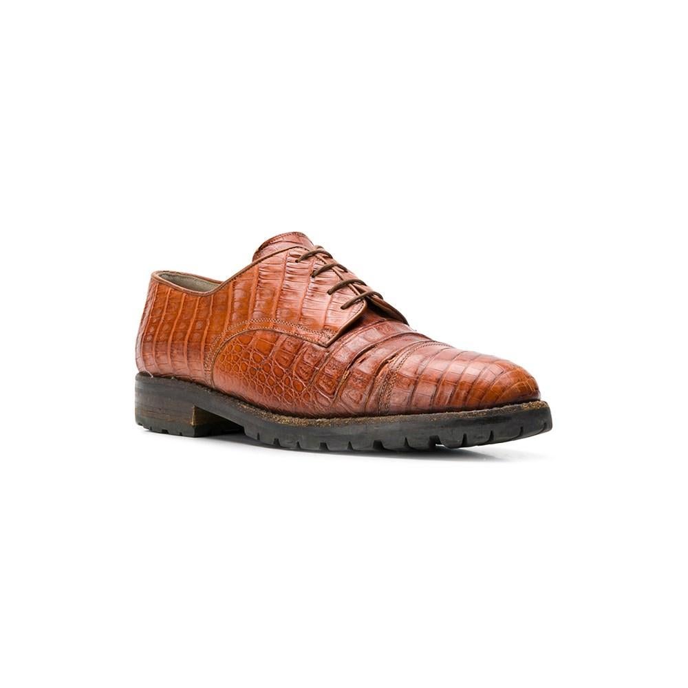 Walter Steiger orange-braune Krokodilleder-Schnürschuhe aus den 90ern. Gummisohle.

Größe: 44 IT

Flache Messungen
Länge der Einlegesohle: 28 cm

Produkt-Code: A8141

Anmerkungen: Der Artikel weist leichte Gebrauchsspuren auf, wie auf den Bildern zu