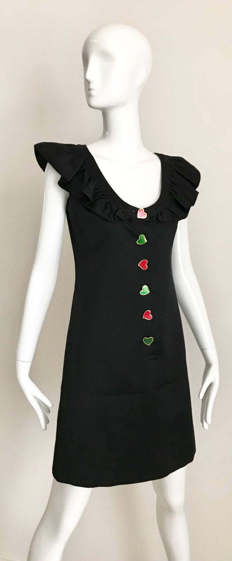 What a fun vintage cocktail party dress from Yves Saint Laurent.  Ruffle neckline and colorful hearts button.  Label marked 36 fr/ 
Bust: 34