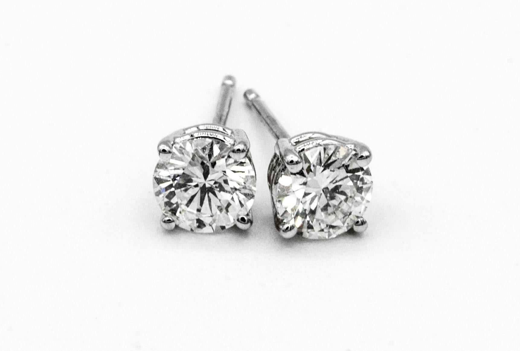 .91 Carat Diamond Stud earrings in 14K White Gold
A pair of Diamond stud earrings weighing .91 Carats total. 
Color is G SI1, and G VS2 ( EGL Certificates)
5.1 MM Diameter, beautifully cut and perfectly matched pair 
