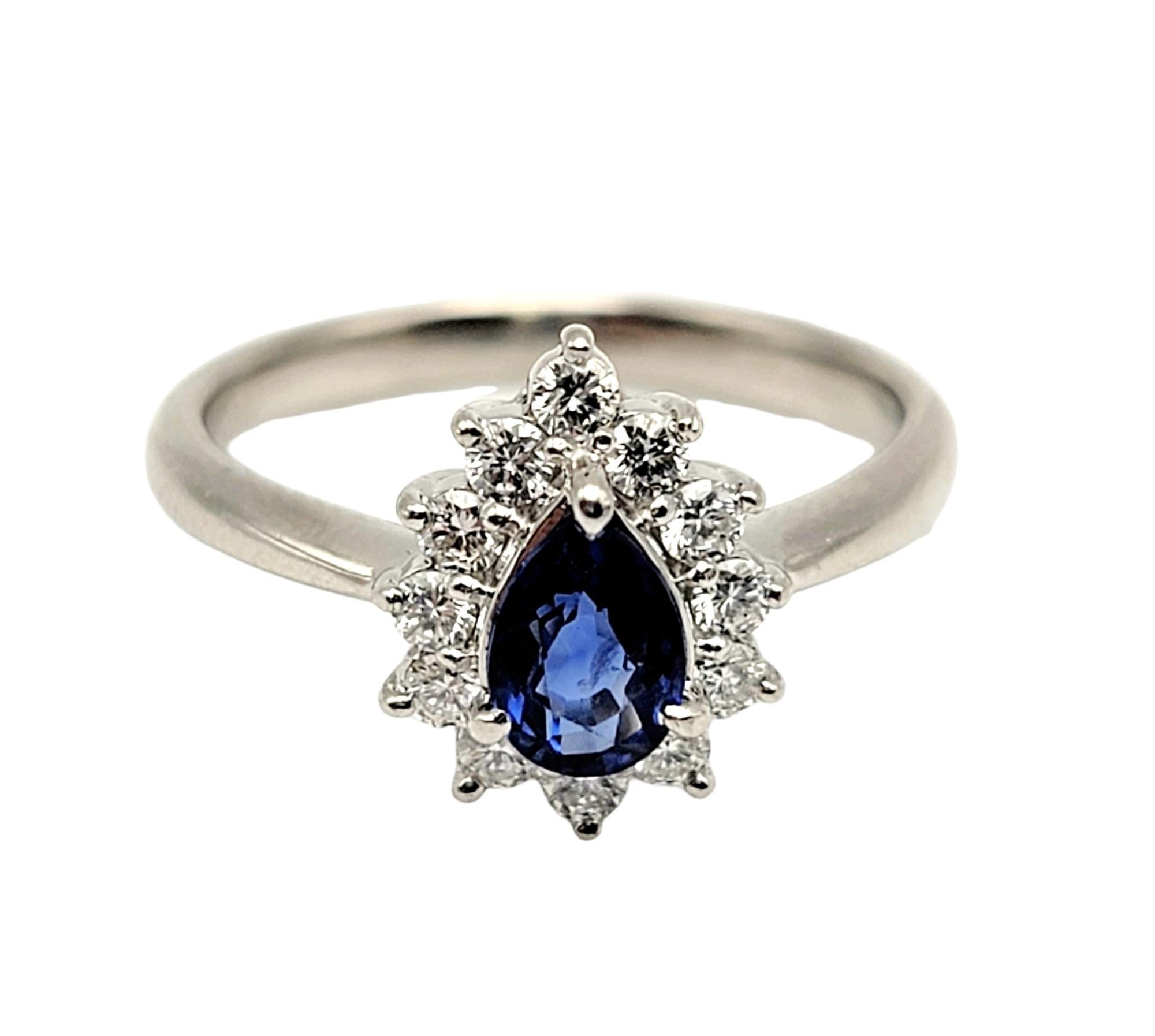 Contemporary .91 Carats Total Natural Pear Cut Sapphire and Diamond Halo Platinum Ring For Sale