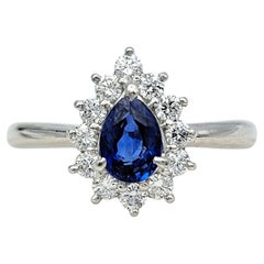 Pear Cut Natural Blue Sapphire and Diamond Halo Ring in Platinum
