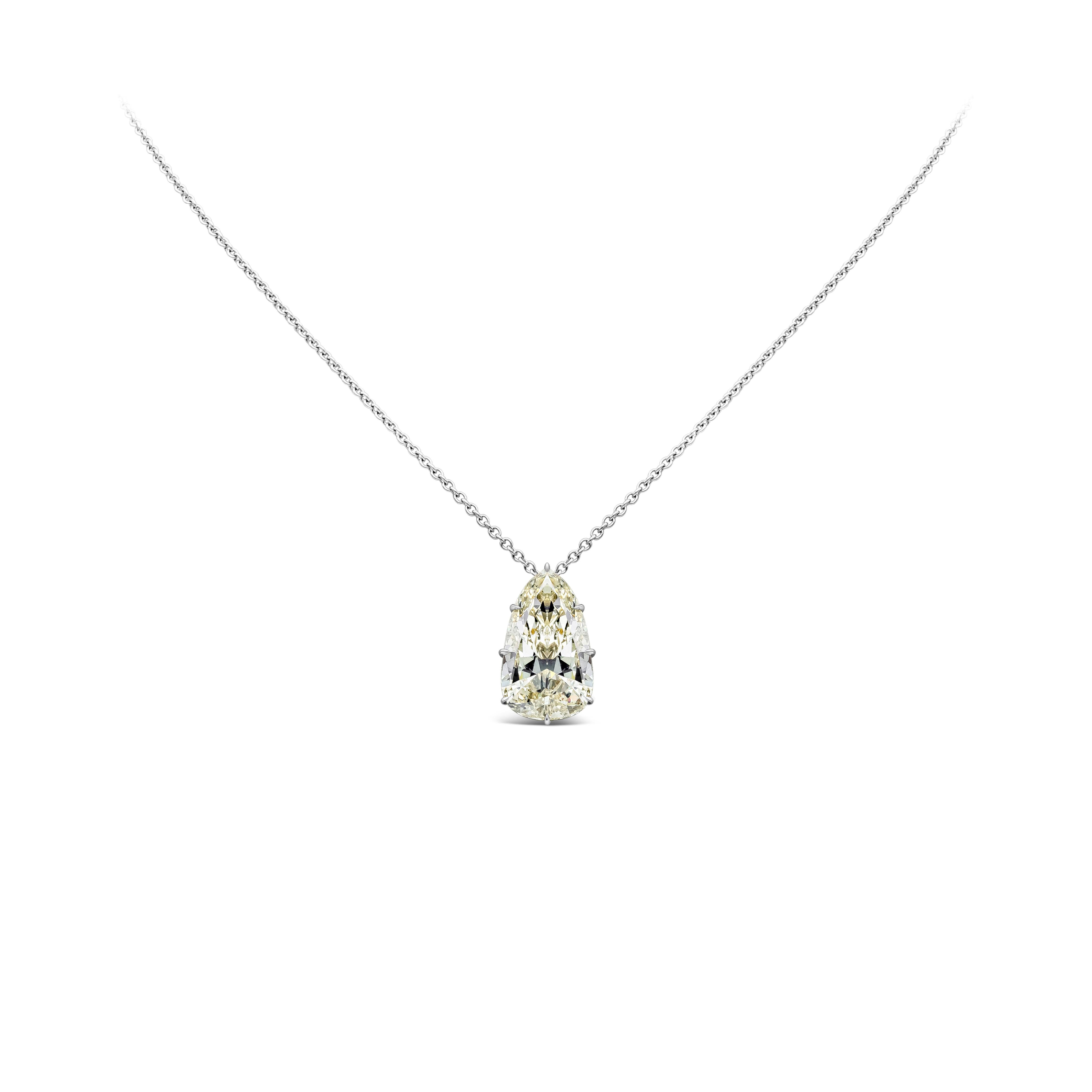 A bold solitaire pendant necklace showcasing a 9.10 carat pear shape diamond, K Color and VVS2 in Clarity. Set in 8 prong, Made with Platinum. 18 inches in Length