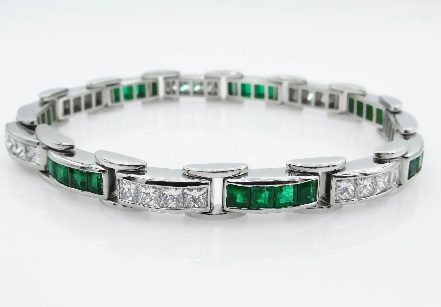 An Amazing Estate Handmade Platinum (stamped) Gemologic appraised Tennis Bracelet with Diamonds and Green Emeralds.
There are over 28 Princess cut Diamonds in F-G color, VS clarity over all; estimated total weight of the diamonds is 4.7ctw. The 28