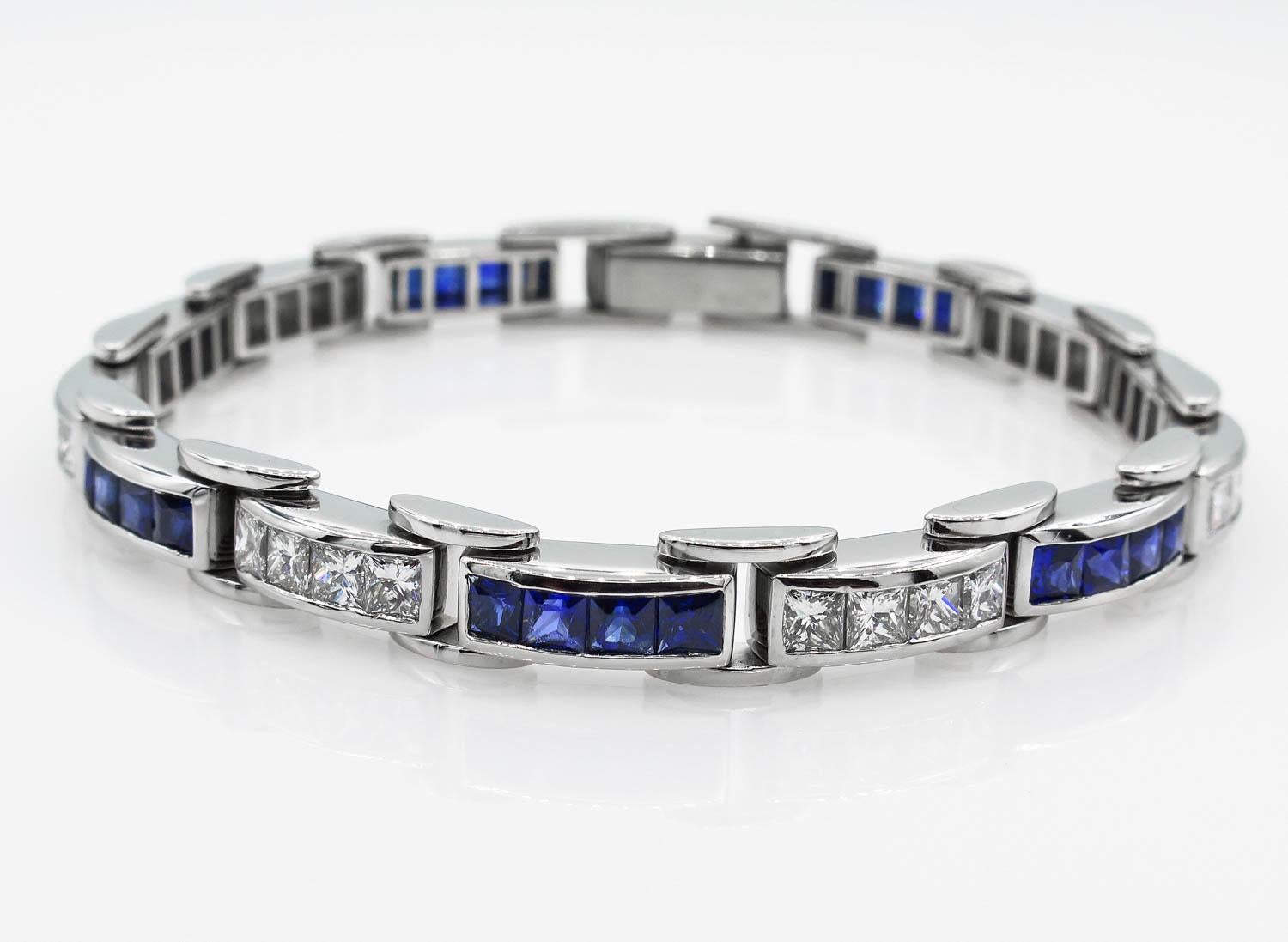 An Amazing Estate Handmade Platinum (stamped) Gemologic appraised Tennis Bracelet with Diamonds and Sapphires.
There are over 28 Princess cut Diamonds in F-G color, VS clarity over all; estimated total weight of the diamonds is 4.7ctw. The 28