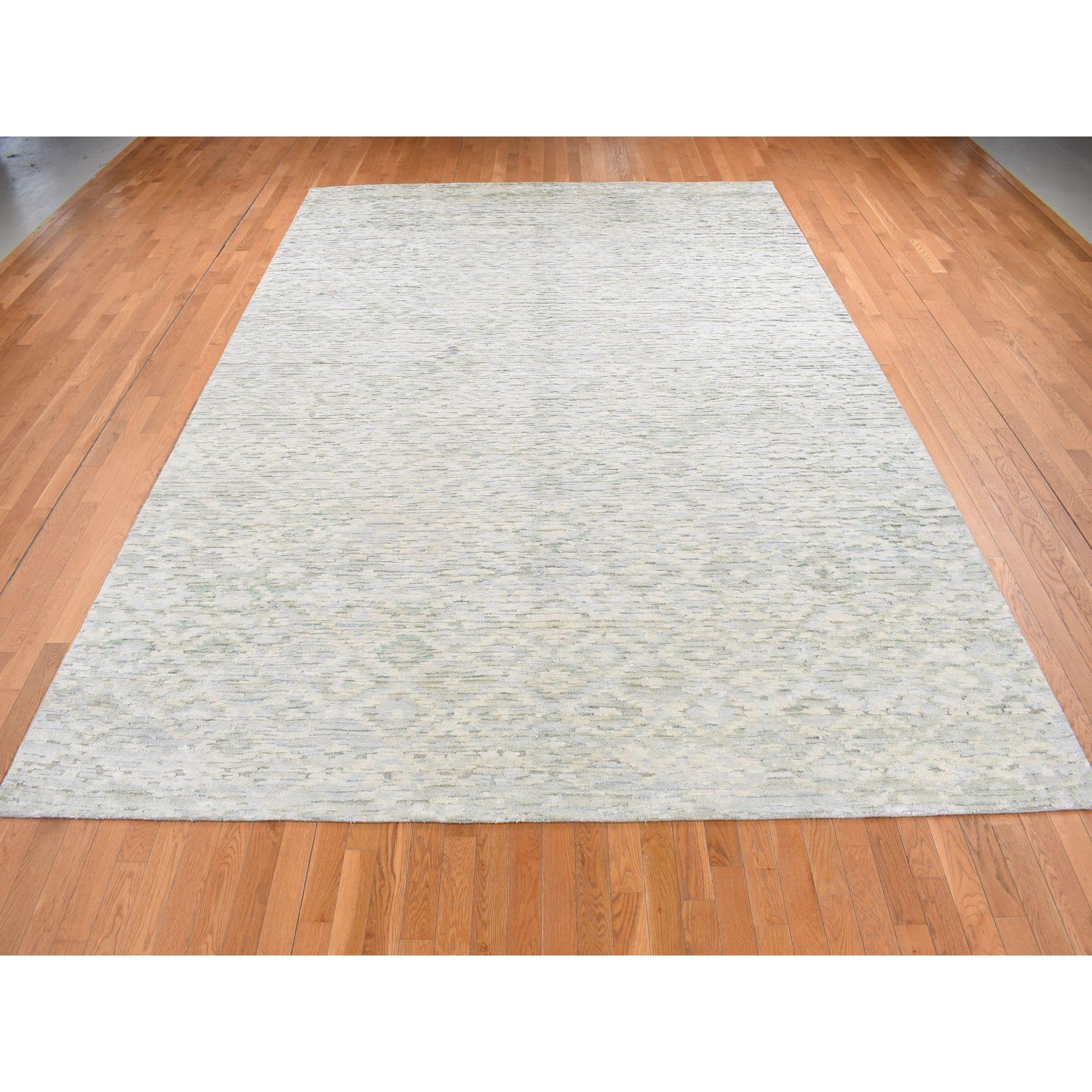 Ivory, Pure Silk with Textured Wool, Fluffy Collection, Hand Knotted, Oriental Rug Primary materials: Wool & Silk
Latex: No Pile 
height: 0.25 Inches Style: Transitional
Primary color: Ivory
Secondary colors: Cream Color
Pattern: Oriental