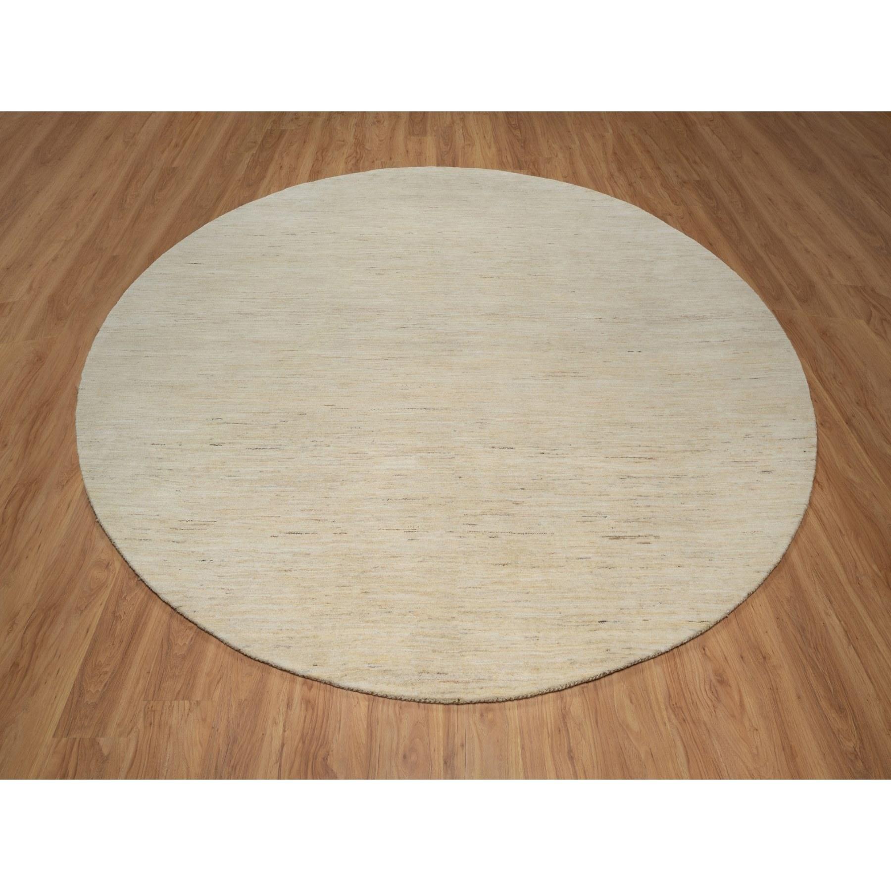 Bone White, Thick and Plush, Modern, Plain Design, Lori Buft Gabbeh, Pure Wool, Hand Knotted, Round, Oriental Rug
Primary materials: Wool
Latex: No Pile 
height: 0.25 Inches
Style: Contemporary
Primary color: Ivory
Secondary colors: None
Pattern: