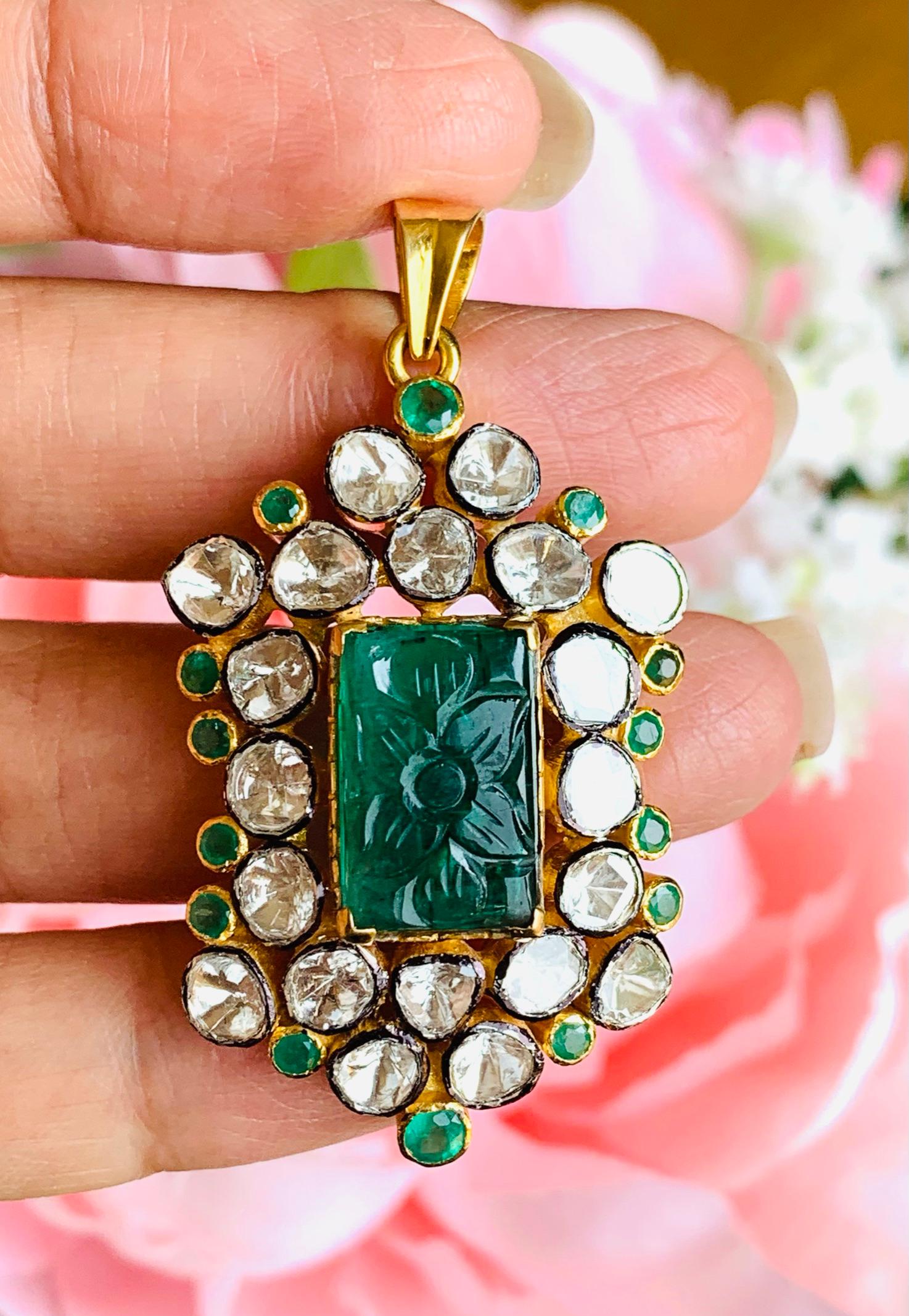 A stunning statement pendant cast in 18-karat gold & sterling silver. It is set in 9.12 carats Carved emerald & illuminated with 3.31 carats rose cut diamonds. 

FOLLOW  MEGHNA JEWELS storefront to view the latest collection & exclusive pieces. 