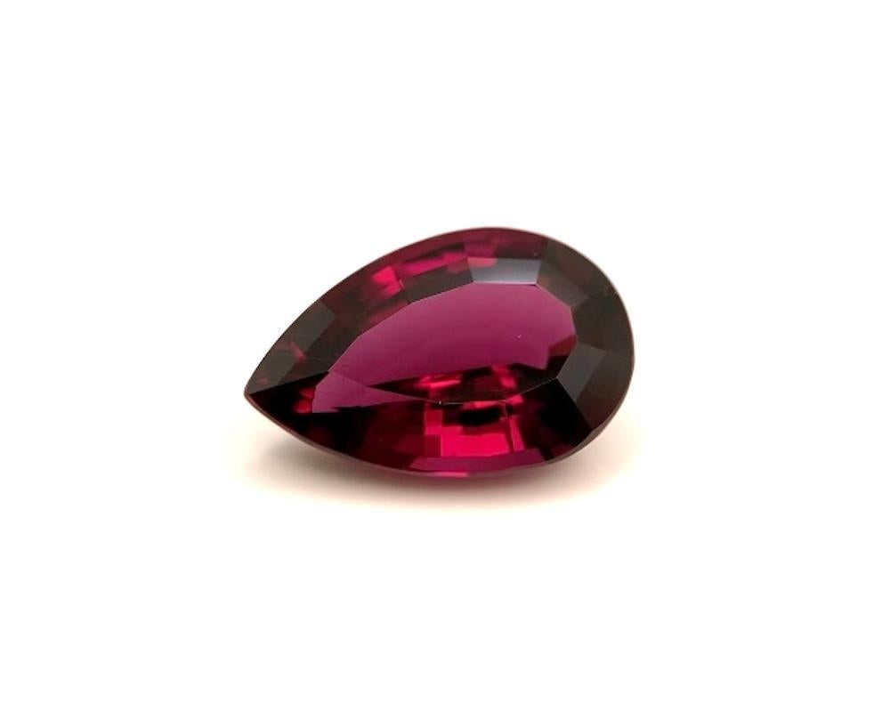 This large rhodolite garnet has a rich burgundy color and is a perfectly symmetrical pear! It has exceptional clarity and excellent luster, with flashes of pomegranate reds and deep purplish rose hues. Measuring 16.15 x 10.66 x 6.74 millimeters and