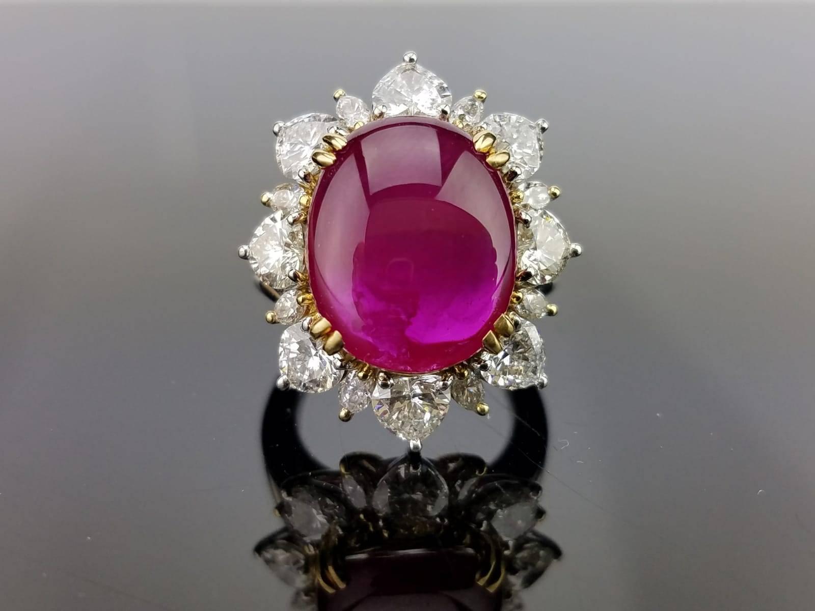 A beautiful 9.13 carat Burmese Ruby opaque cabochon, sorrounded by 2.55 carats of heart shape Diamonds, all set in platinum.

Stone Details: 
Stone: Burmese Ruby
Carat Weight: 9.13 Carats

Diamond Details: 
Total Carat Weight: 2.55 carat
Quality: VS