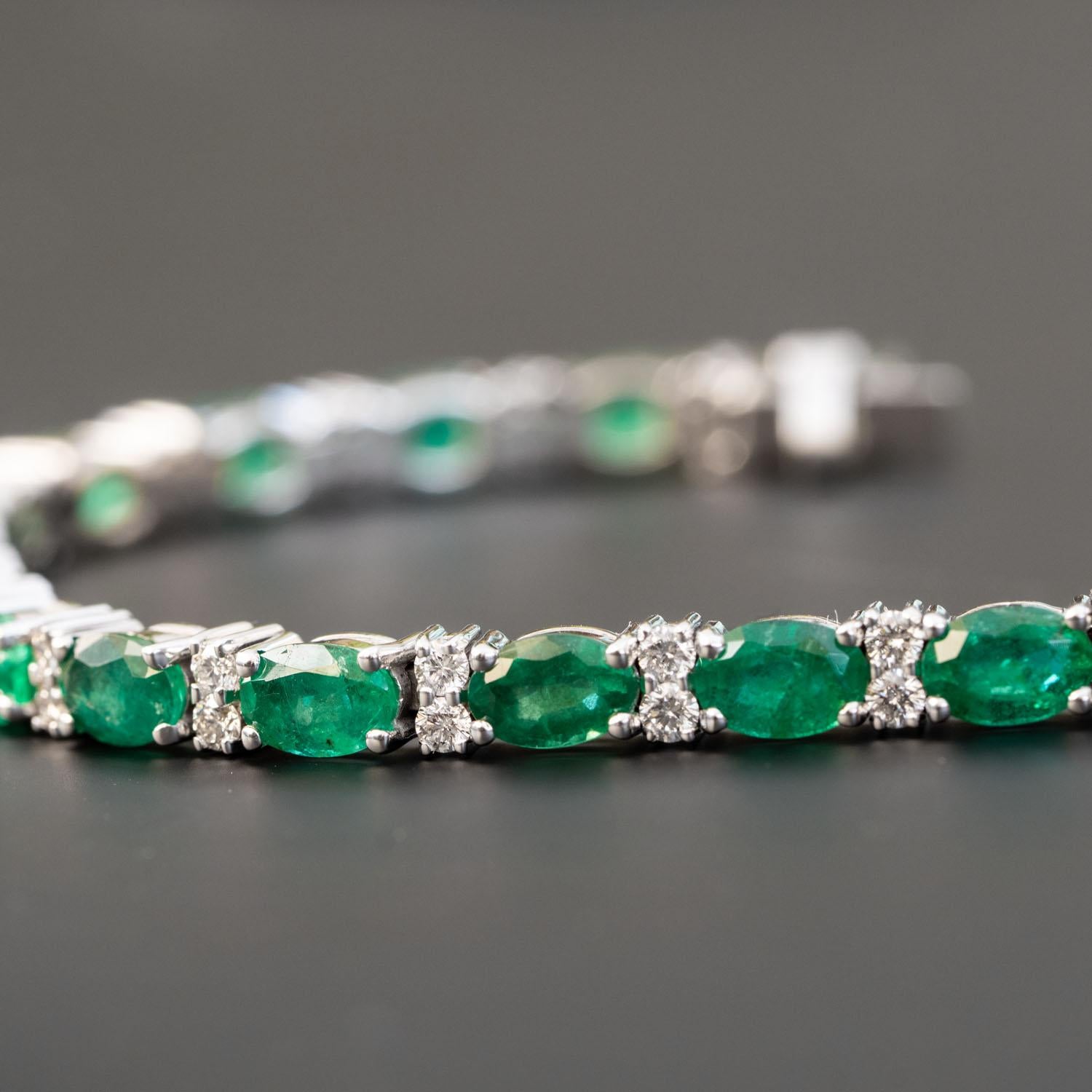 The timeless interspersed design wraps the wearer’s wrist in alternating oval faceted green natural emerald and sparkling white natural diamonds for a luxe look sure to earn appreciative glances. Each individually-set gemstone in the series lightly