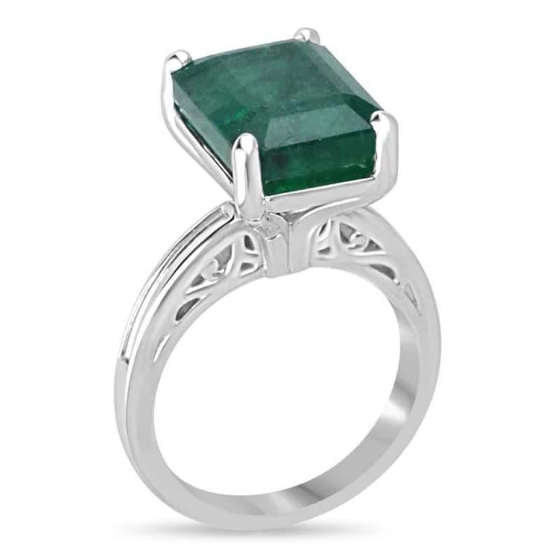 This exquisite solitaire ring showcases a massive 9.16-carat emerald-cut emerald, radiating a lush deep green hue with captivating bluish-green undertones. The unique gallery design adds a distinct flair to the elegant simplicity of the piece,