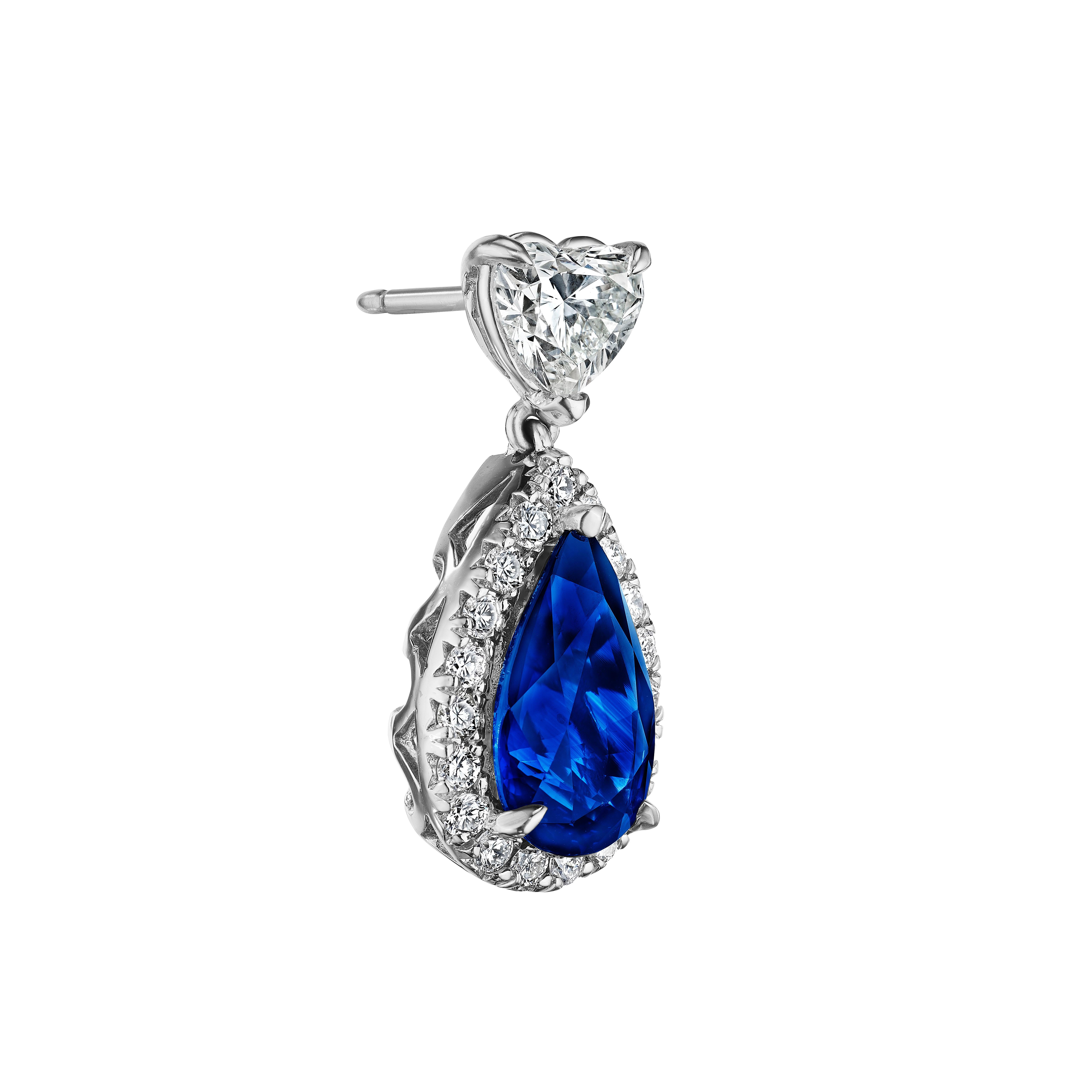 •	18KT White Gold
•	9.18 carats
•	Sold as a pair 

•	Number of Pear Shape Sapphires: 2
•	Carat Weight: 7.09ctw

•	Number of Heart Shape Diamonds: 2
•	Carat Weight: 1.46ctw

•	Number of Round Diamonds: 38
•	Carat Weight: 0.63ctw

•	This pair of