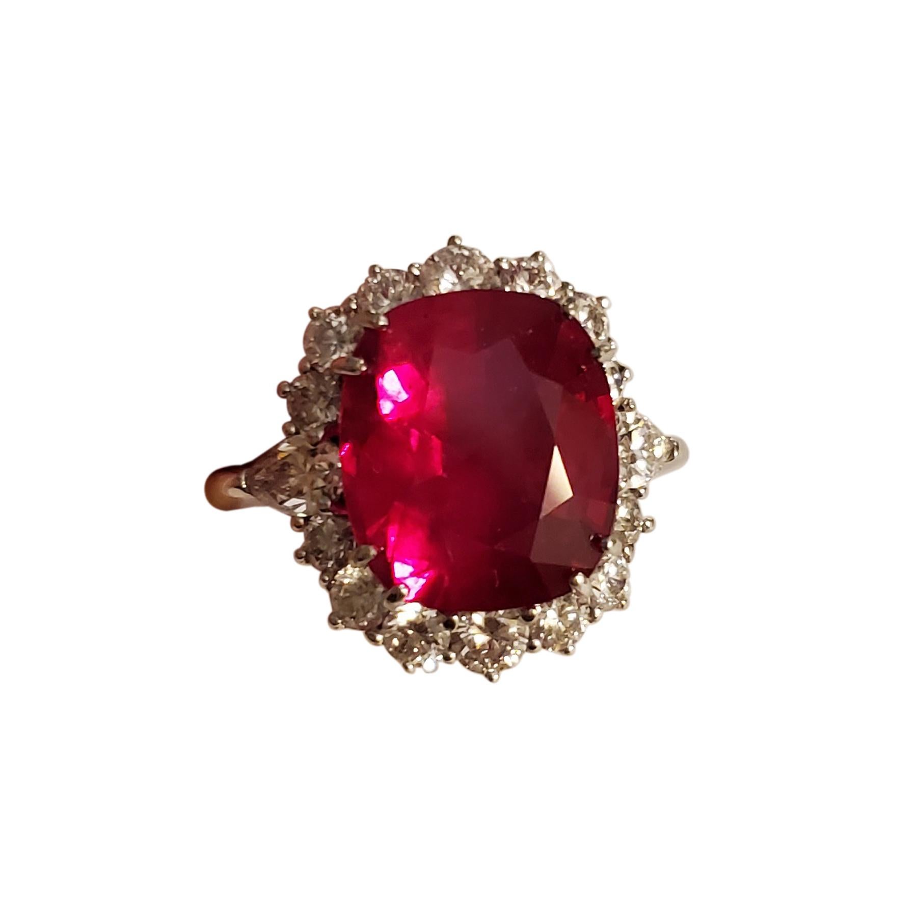 9.19 Carat Cushion-Cut Ruby and White Diamond Gold Cocktail Engagement Ring:

A beautiful ring, it features a striking cushion-cut intense red ruby weighing 9.19 carat surrounded by a halo of white round brilliant-cut diamonds weighing 1.63 carat.
