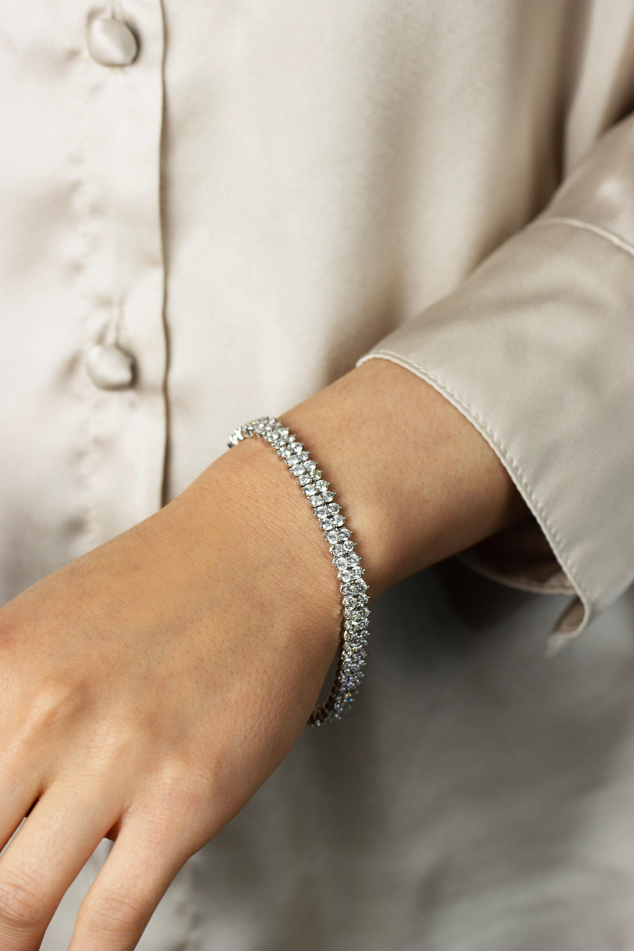 This classic tennis bracelet features a two rows of dazzling round diamonds set in a 18K white gold mounting weighing 9.19 carats total. Each diamond is set in a traditional three prong setting, 7 inches in length and 6.55mm in width.

Roman Malakov