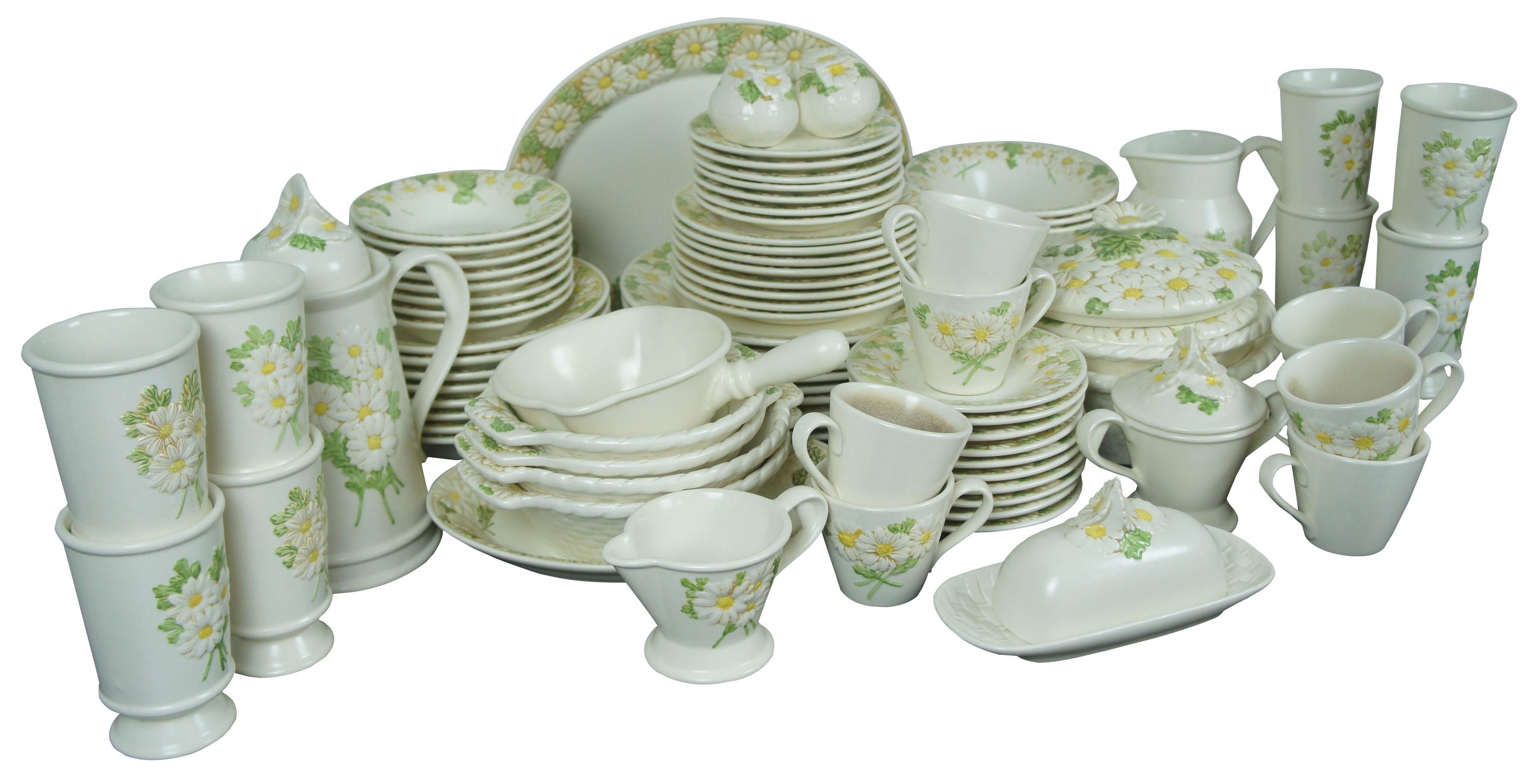 91 piece set of retro mid century china by Metlox of California.  Featuring the Poppy Trail floral pattern with raised daisy.  Set includes platters, plates, bowls, cups, tea / coffee set and many serving pieces.


