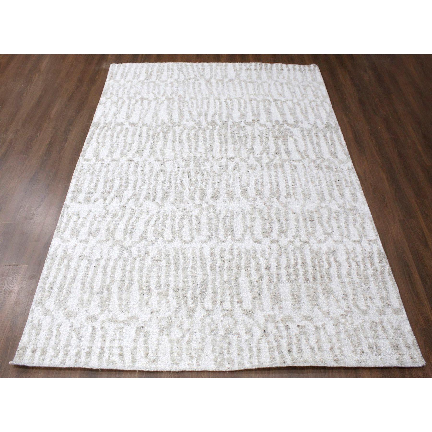 Bone White, Minimalist Swedish Design, Hand Knotted, Natural Wool, Oriental Rug
Primary materials: Wool
Latex: No Pile 
height: 0.25 Inches
Style: Contemporary
Primary color: Ivory
Secondary colors: Beige, Brown
Pattern: Oriental