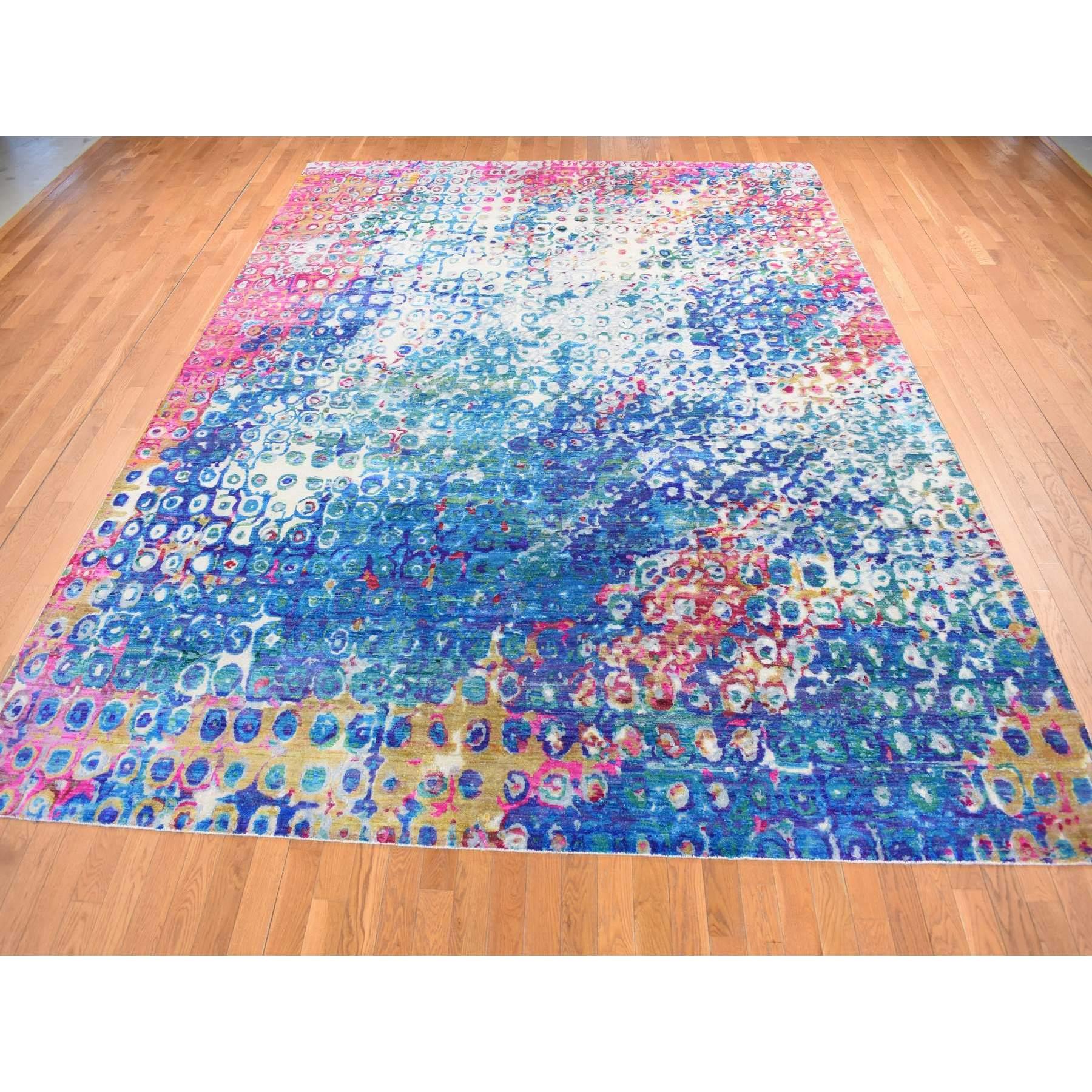 Maya Blue, THE PEACOCK, Colorful, Sari Silk, Hand Knotted, Oriental Rug 
Primary materials: Wool & Sari Silk
Latex: No Pile height: 0.25 Inches
Style: Transitional
Primary color: Blue
Secondary colors: Gray, Green, Yellow, Red, Violet Blue, Pink,