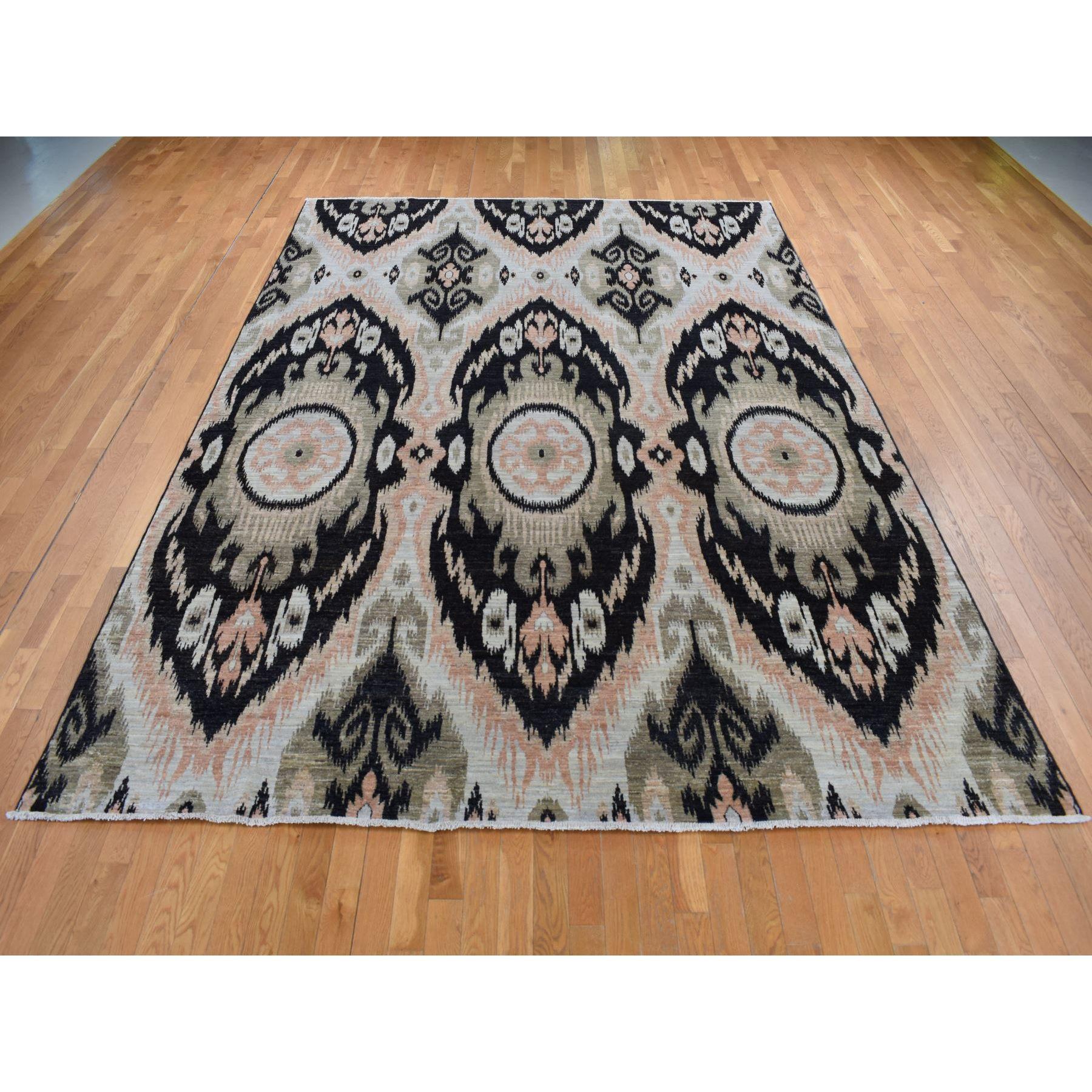 Eerie Black, 100% Wool, Ikat Uzbek Design, Hand Knotted, Oriental Rug
Primary materials: Wool
Latex: No Pile 
height: 0.25 Inches
Style: Transitional
Primary color: Black
Secondary colors: Brown, Ivory
Pattern: Oriental
