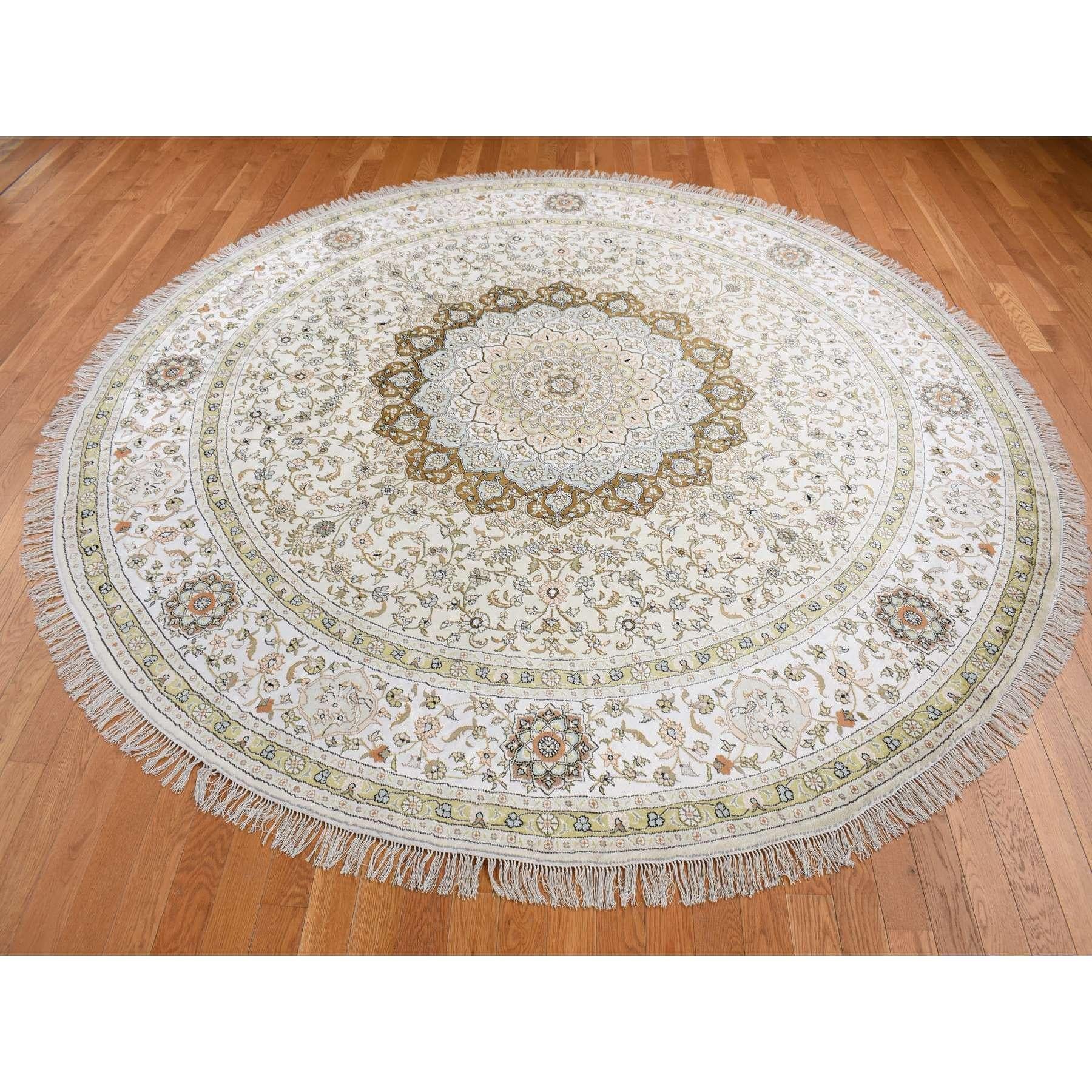 Ivory, Silken, Tabriz Design, 300 KPSI, Hand Knotted, Round Oriental Rug
Primary materials: Silk
Latex: No Pile 
height: 0.25 Inches
Style: Traditional
Primary color: Ivory
Secondary colors: Brown, Green, Orange, Gray
Pattern: Oriental