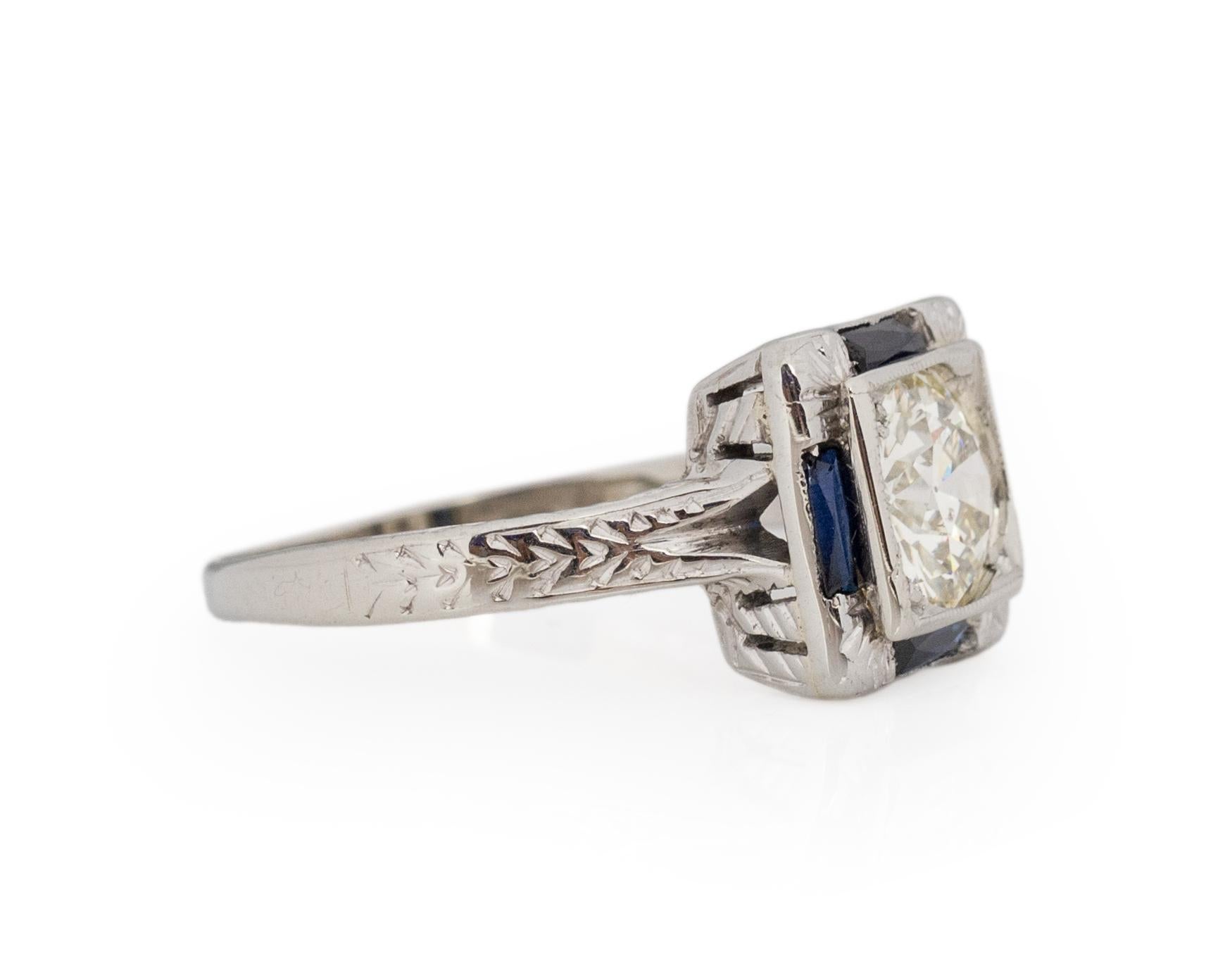 Ring Size: 6.5
Metal Type: 18karat White Gold [Hallmarked, and Tested]
Weight: 3.0 grams

Center Diamond Details:
Weight: .92carat
Cut: Old European brilliant
Color: K
Clarity: SI2

Side Stone Details:
Weight: .25carat, total weight
Cut: Antique