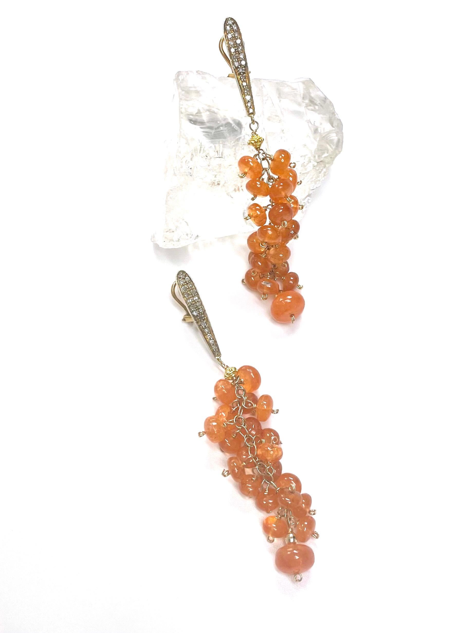 Description
Vibrant Spessartite garnet individually hand wrapped with 14k yellow gold wire, suspended from vermeil pave diamond ear posts. 
Item # E3290
Check out matching necklaces (see photos), Item # N3796 (multi strand) and N3703