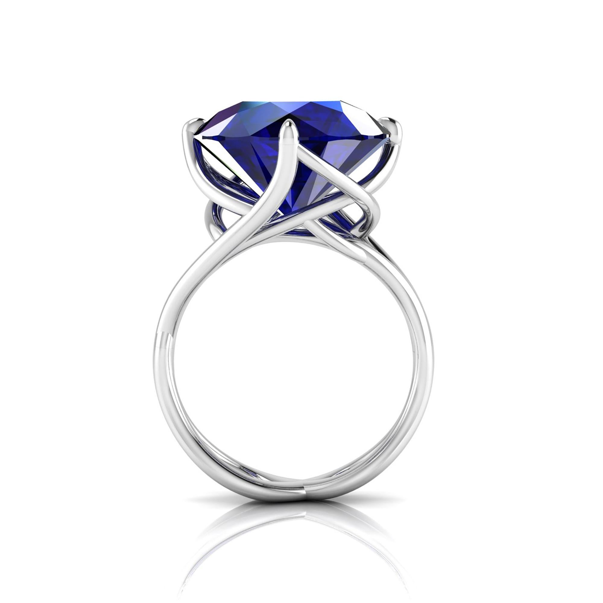 9.20 carat natural Tanzanite of a deep blue/purple color, unique in its splendor, in a one of a kind, hand made 18k white gold ring, designed and conceived in New York City. A design that recall nature's vines and ever flowing life of exotic