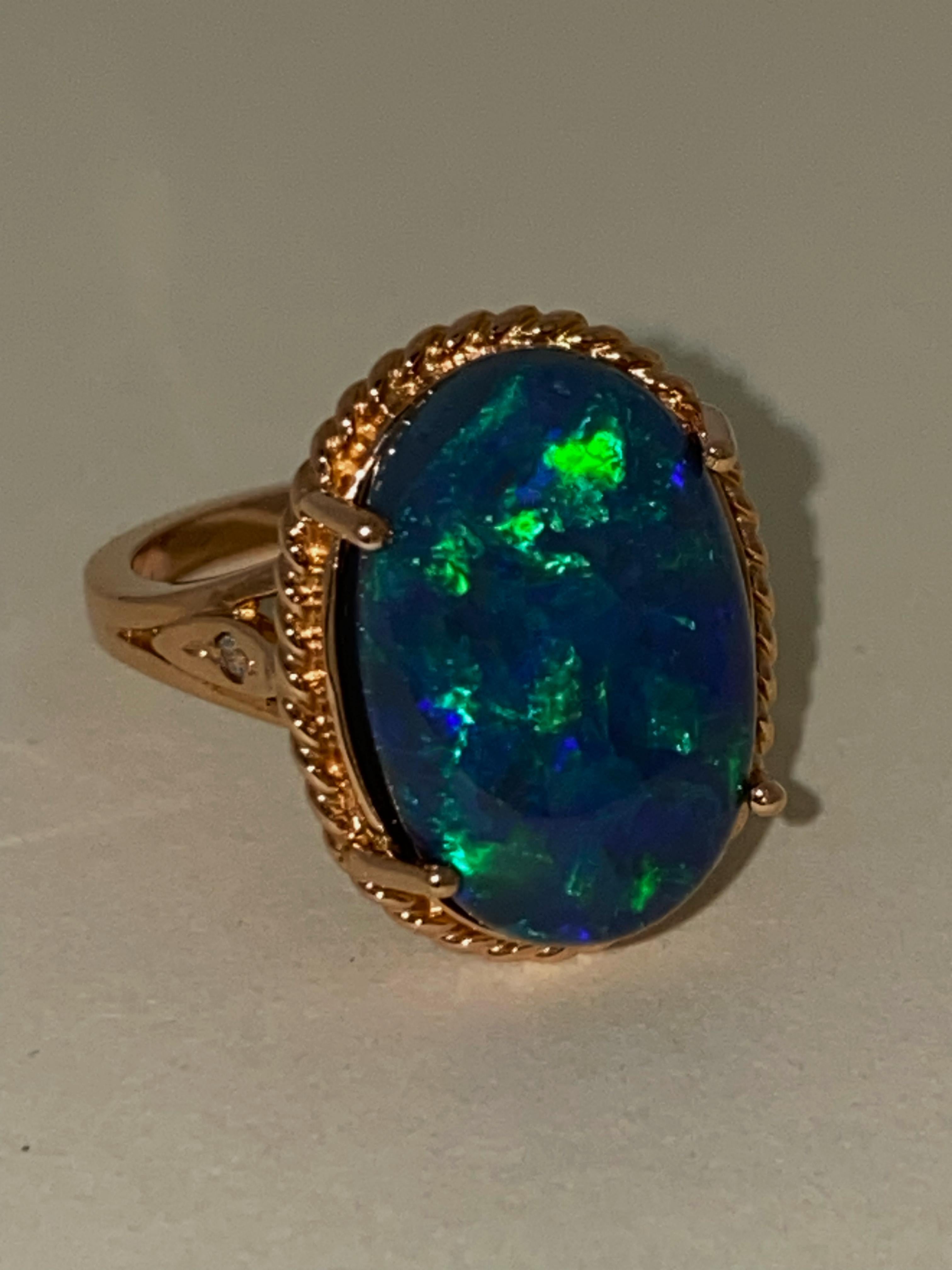 This magnificent Cocktail Ring features 
Australian Black Opal
of Lightning Ridge, NSW origin, 
of impressive & rarely encountered size:
9.20ct (17.13mm x 11.36mm x 7.41mm)

It's Natural, of type 1, 
meaning that it hasn't been treated or enhanced