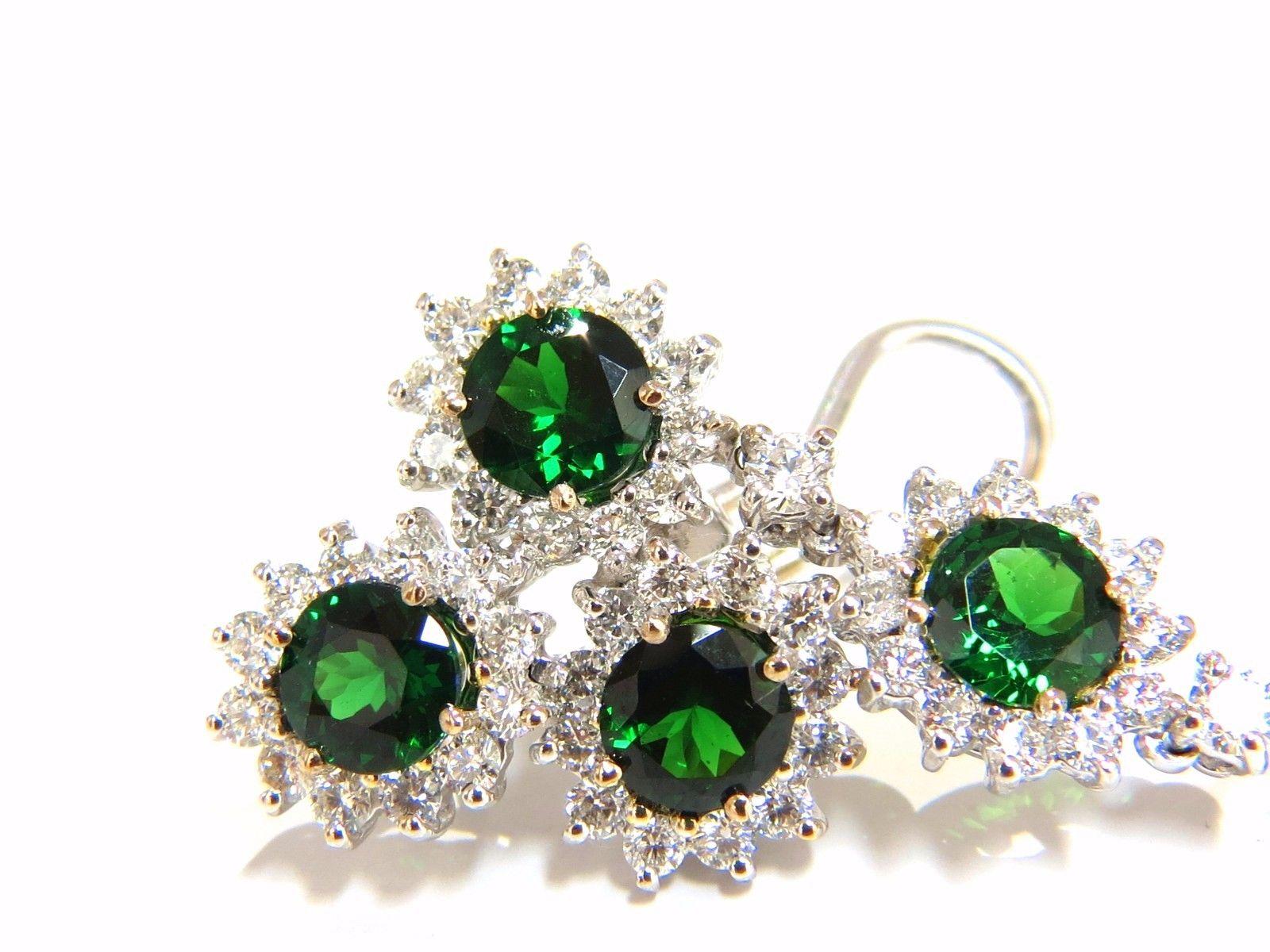 Dangling  (5) Cluster Tsavorite & Diamond Earrings

9.20ct. Natural Vivid Green Tsavorites

average each: 6mm diameter 

Full cut round brilliants.

Excellent, clean clarity & transparent 



4.18ct. round, full cut diamonds.

G-color Vs-2