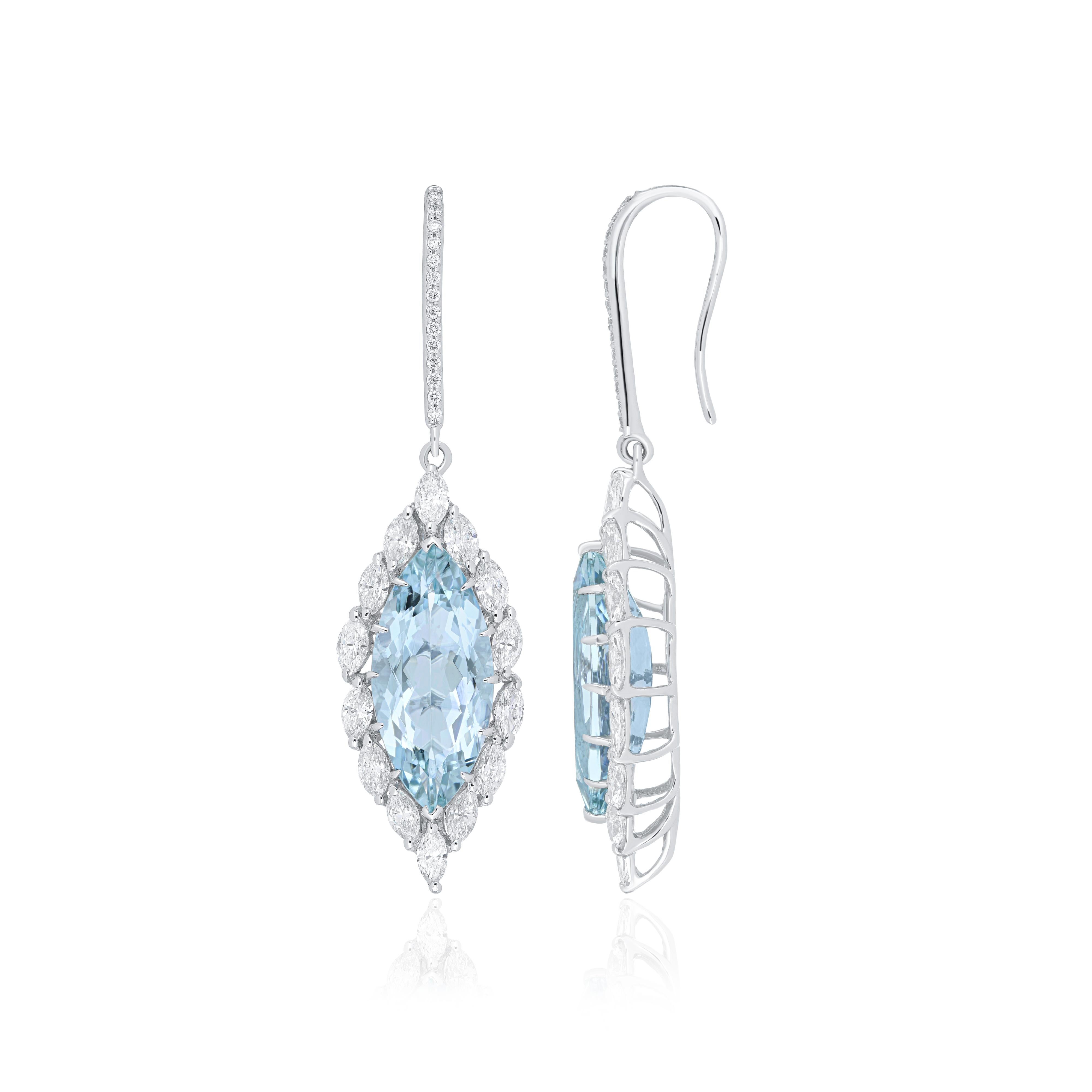 Elegant and exquisitely detailed 18 Karat White Gold Earrings, center set with Aquamarine Marquise 9.20Cts accented with  Marquise & Round Diamonds weighing approx 2.0Cts total. Beautifully Hand crafted in 18 Karat White Gold.

Product Details: -
