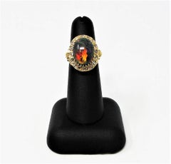 9.21 Carat Oval Cabochon Black Opal and Diamond Halo Cocktail Ring 14 Karat Gold