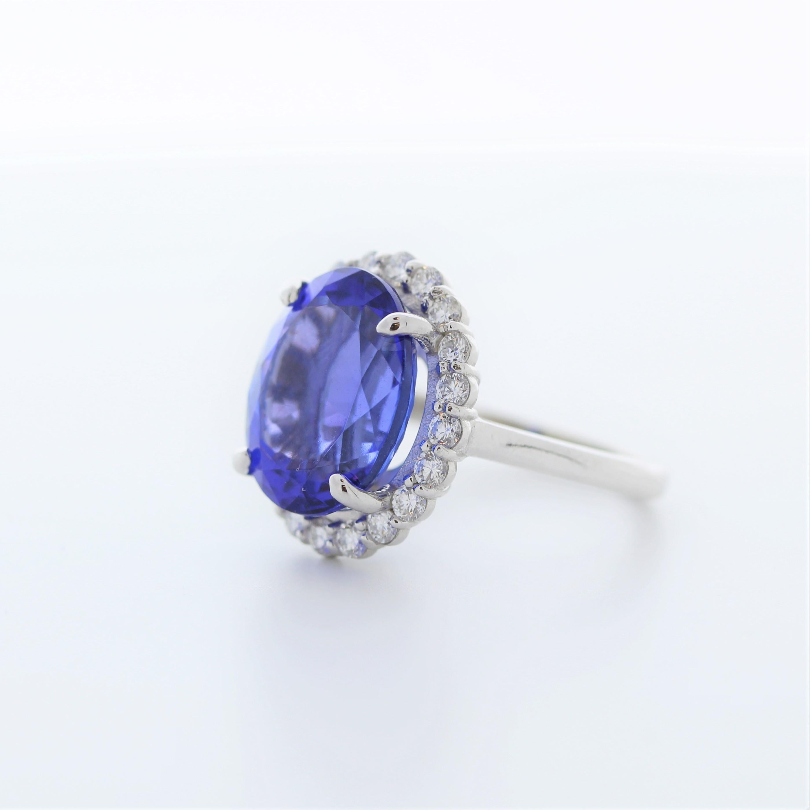 A fashion ring featuring a 14k white gold band with a main stone of a 9.22 carat oval-cut bluish violet tanzanite and 20 round-cut diamonds totaling 0.8 carats as side stones would be a stunning and vibrant choice.