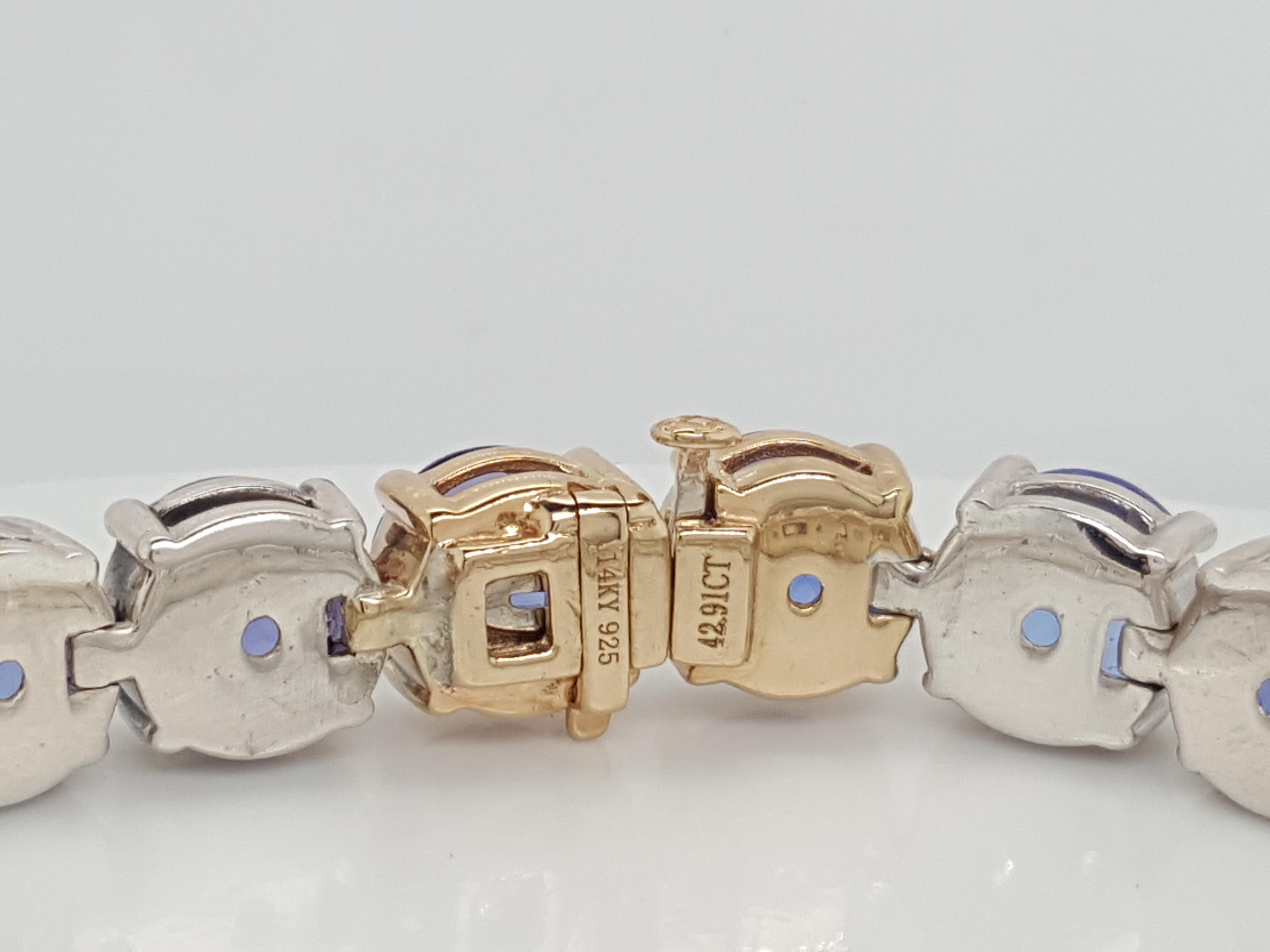 Modern 925 and 14 Karat Gold Blue 42.91 Carat Tanzanite Tennis Line Bracelet